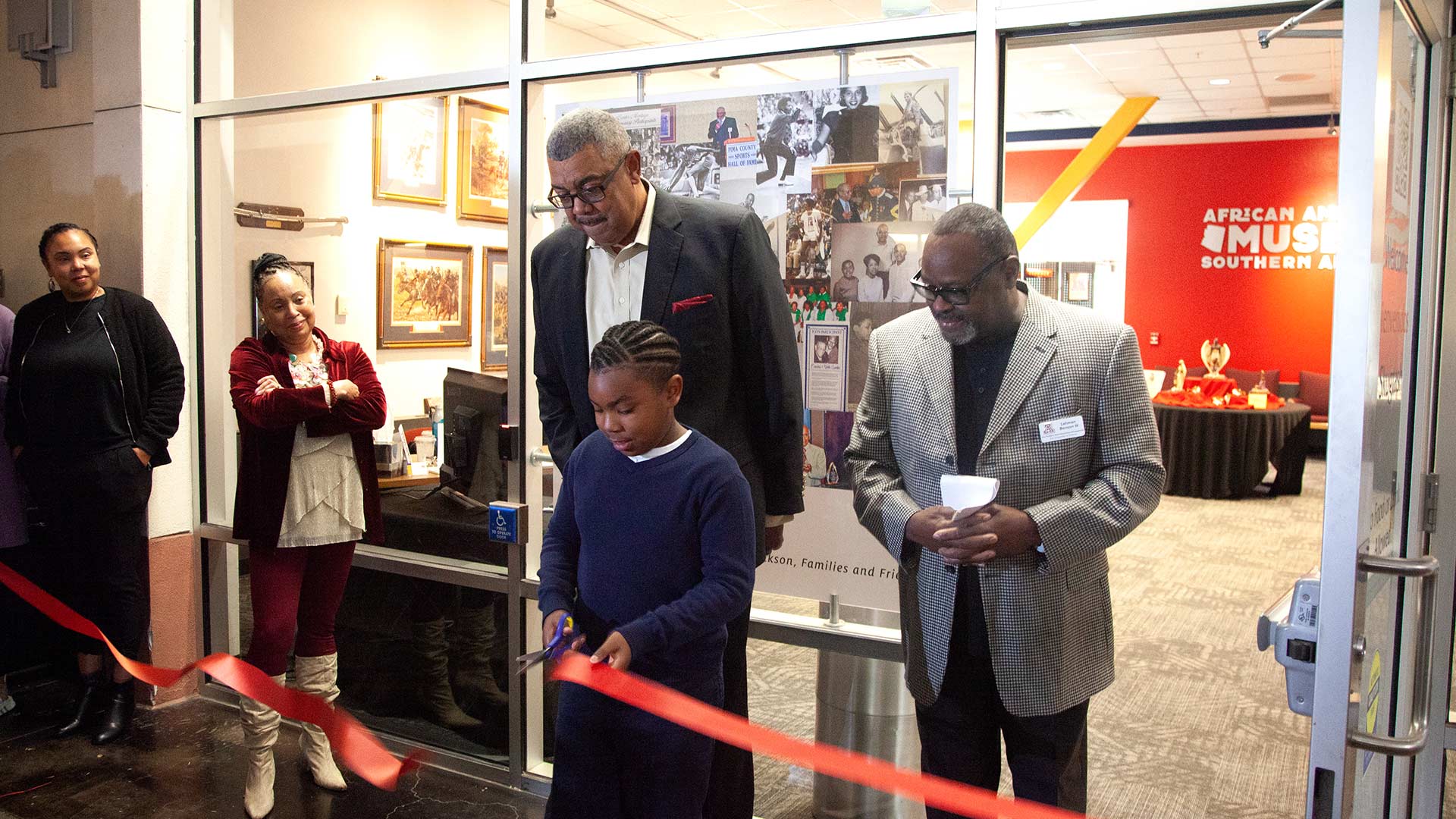 9-year-old Jody cuts the ribbon of the new African American Museum of Southern Arizona on Saturday, Jan. 14, 2023. Jody sparked the idea of creating the museum when he found out there was not a spot in Tucson that shares Black history. 