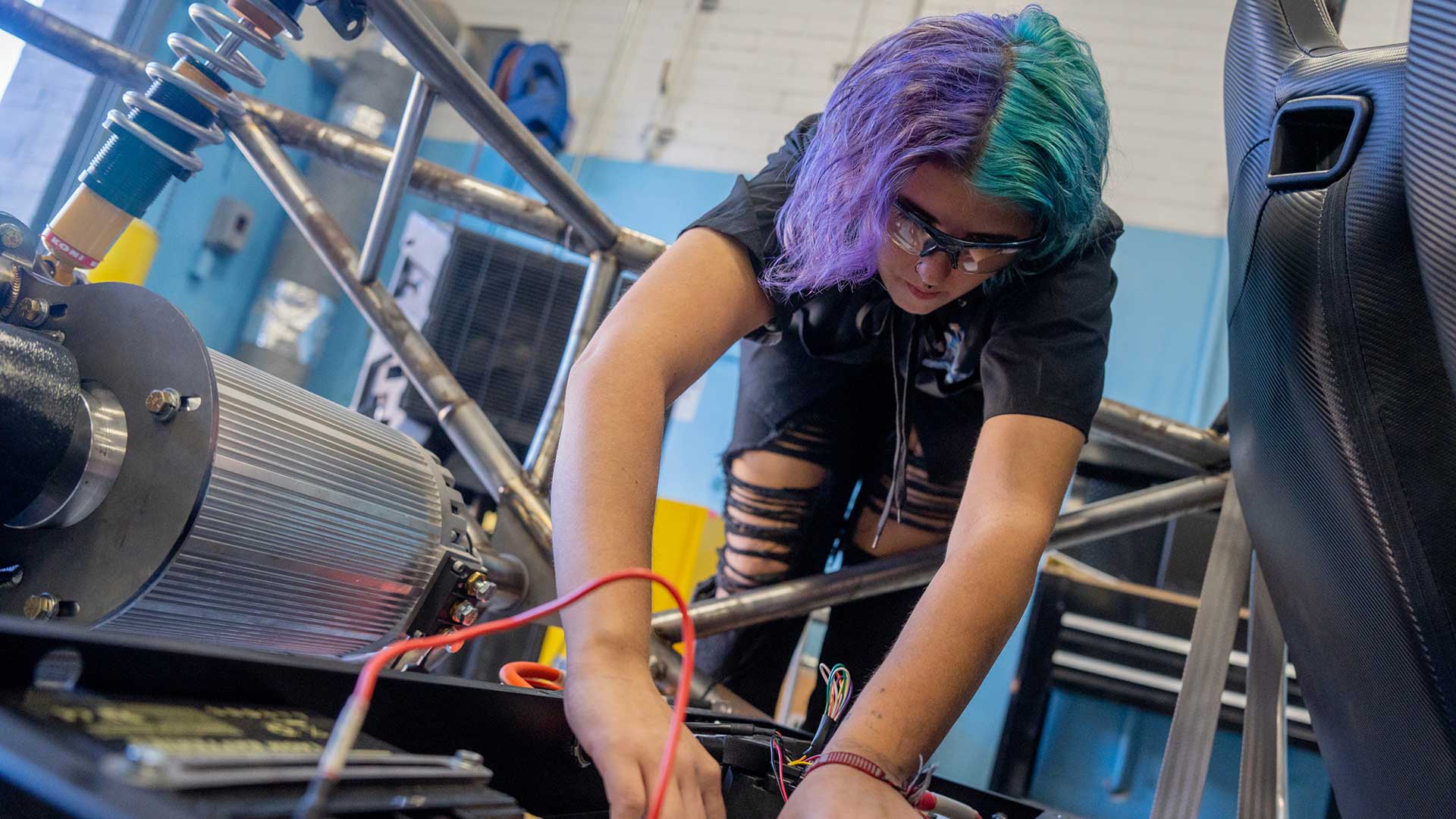 Senior Adrina Wilder works on an electric vehicle during class at Cactus High School in Glendale on Oct. 31, 2022. (Photo by Samantha Chow/Cronkite News)