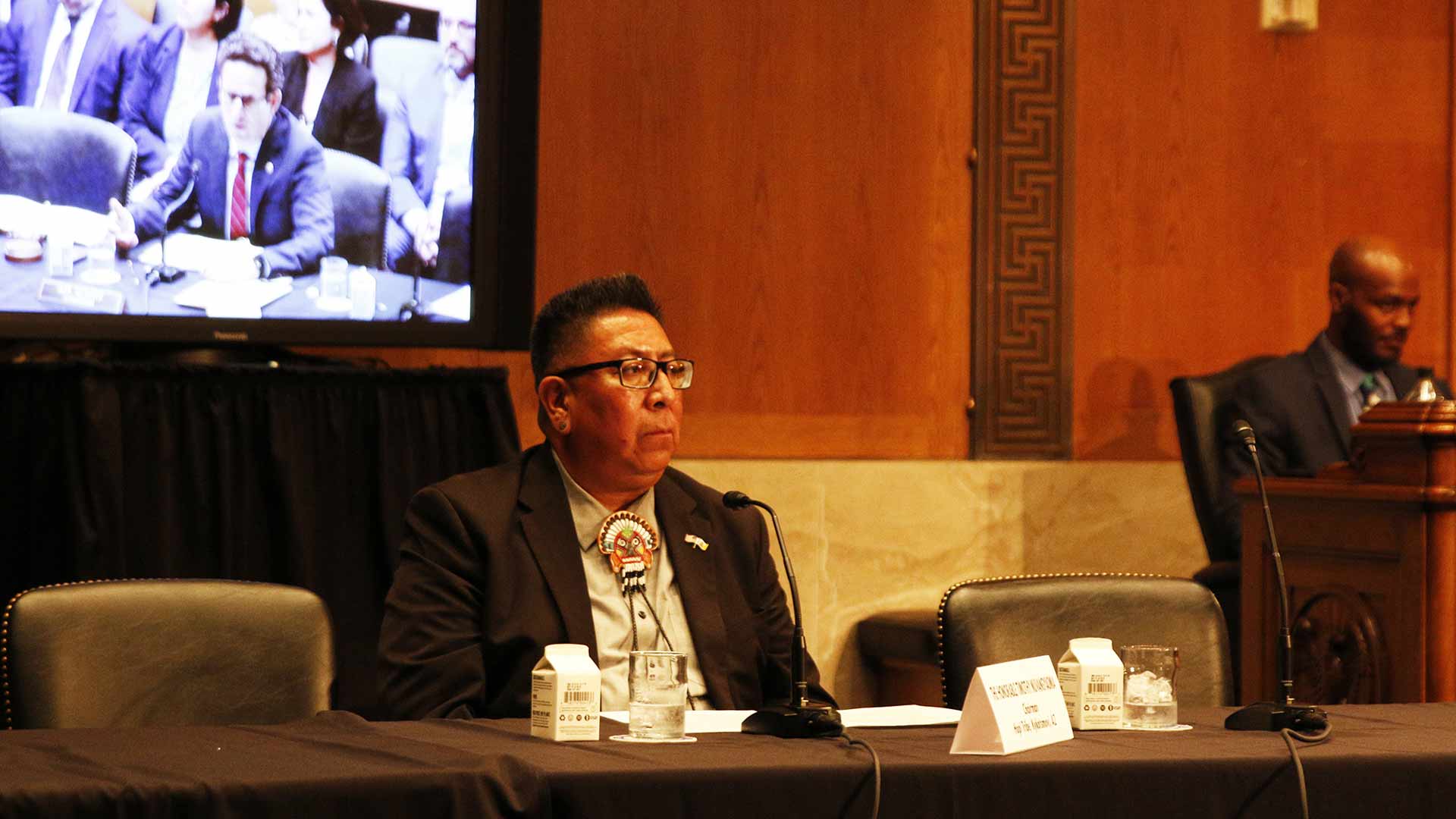Hopi Chairman Timothy Nuvangyaoma testifies to the Senate Indian Affairs Committee, with committee chairman Sen. Brian Schatz, D-Hawaii, shown on the screen behind him. 