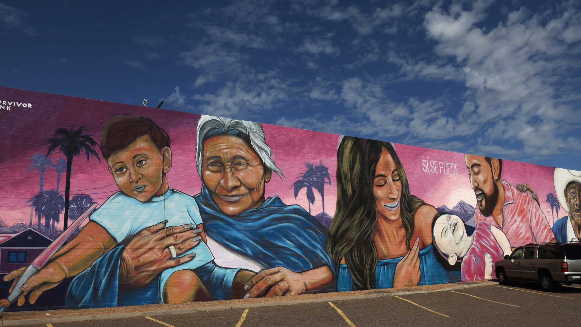 A mural of a Hispanic family emblazoned with the popular Spanish phrase “Si, se puede”
welcomes visitors at Chicanos Por La Causa’s Centro de la Familia in Phoenix on September 13, 2023. 