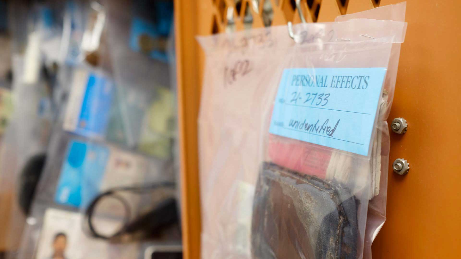 Lockers at the Pima County Medical Examiner’s Office contain belongings recovered alongside migrants who died in the desert. Death investigators use the items to help determine the person’s identity, and return their remains to family. 