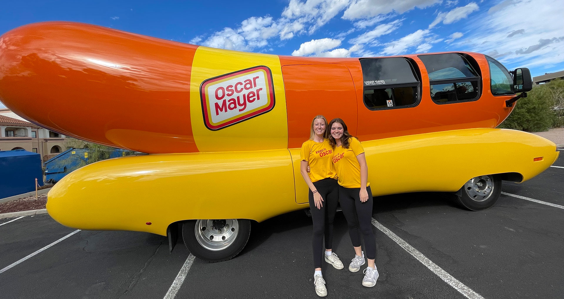 From left to right: Ann Kerr ("Angus Ann") and Allison Silibovsky ("Allie Dog") stand in front of the Oscar-Meyer Weinermobile in Tucson, Ariz. on Friday, Nov. 17. The iconic vehicle has been a part of the brand since the 1930s.  