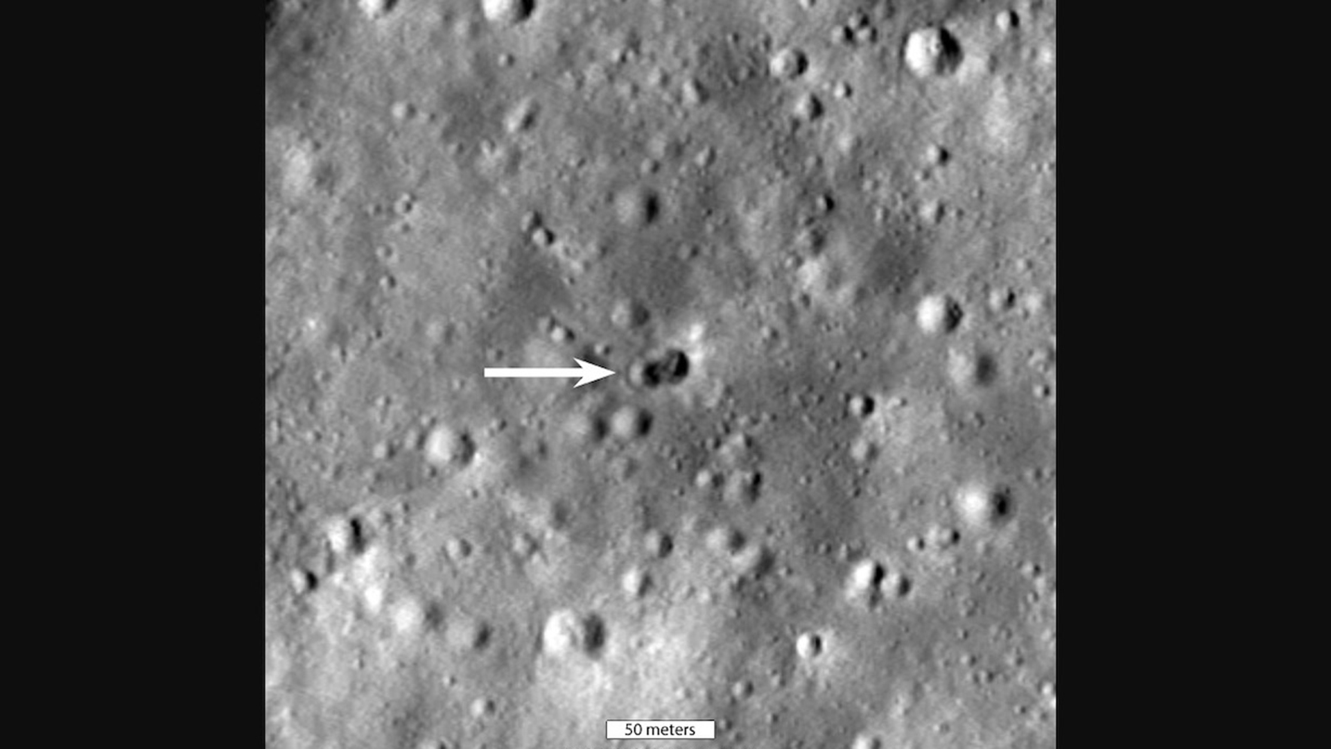 Lunar Reconnaissance Orbiter photograph shows double crater impact of a spent rocket stage on the far side of the moon. 