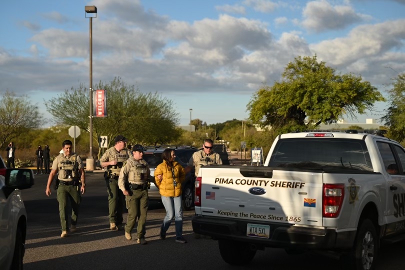 Pima County Sheriff deputies arrest a KJZZ reporter as she covered a demonstration outside the UA Tech/Raytheon in southeast Tucson on Nov. 30, 2023.
