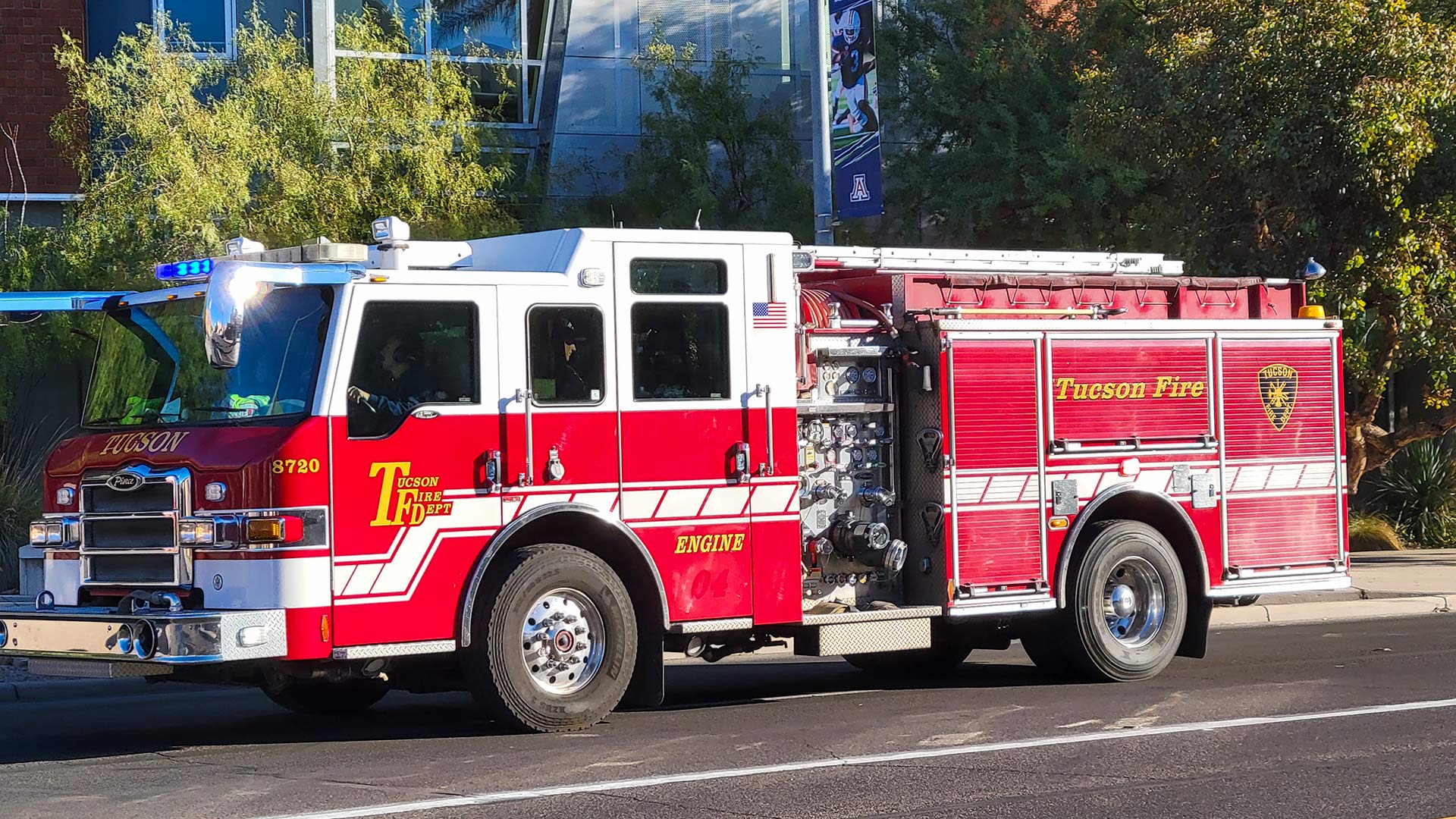 A Tucson Fire Department engine responds to a scene. 