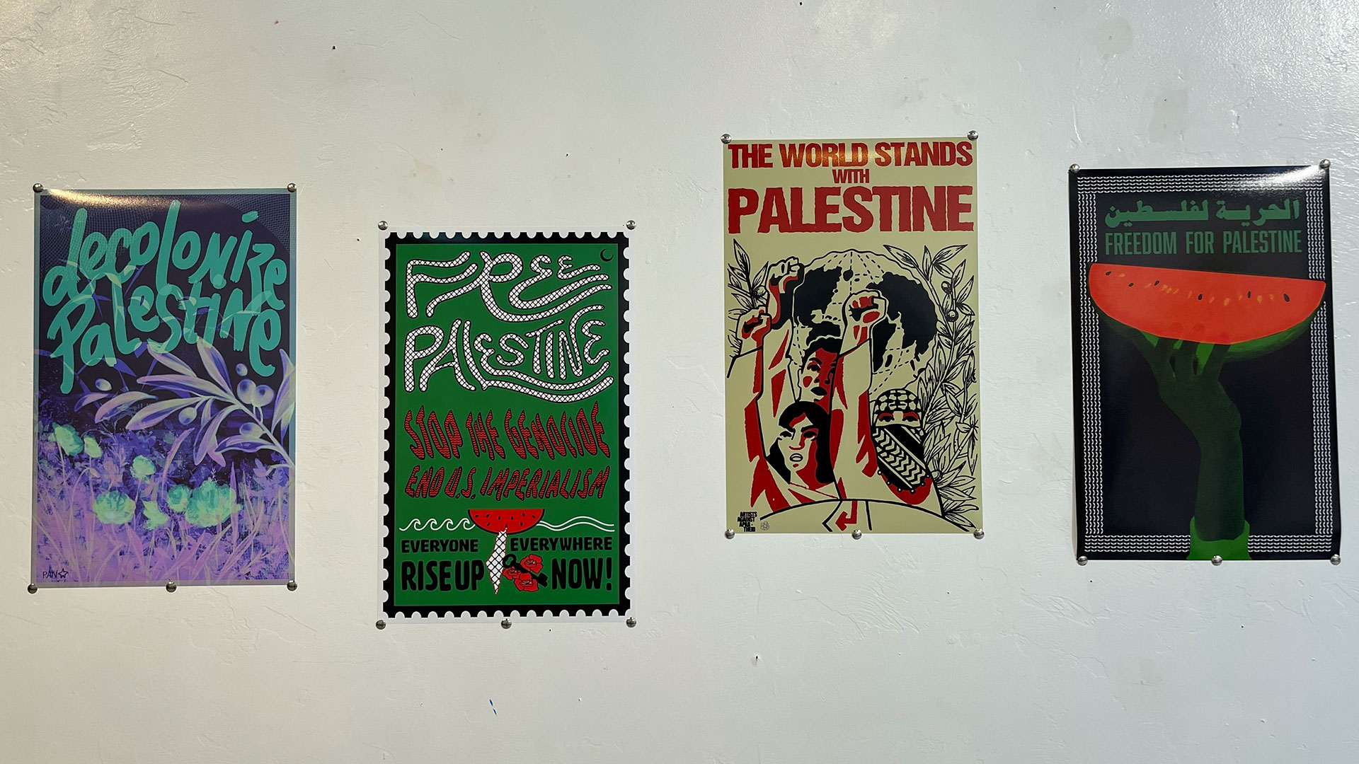Four posters displaying pro-Palestinian messages on display at &Gallery in Tucson, Ariz., on Saturday, Dec. 9, 2023. The watermelon has been a symbol of Palestinian resistance since the 1960s. 