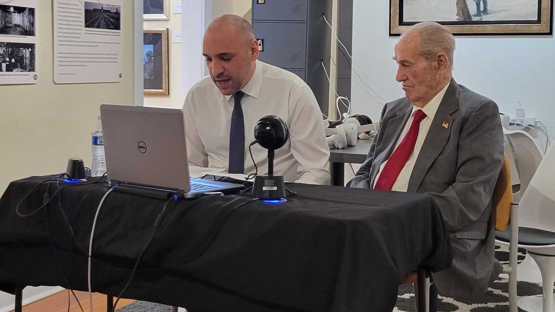 Holocaust survivor Andrew Schot, right, speaks at the Arizona Jewish Historical Society on Feb. 24, 2023, with Anthony Fusco Jr., who is the society’s education coordinator. 