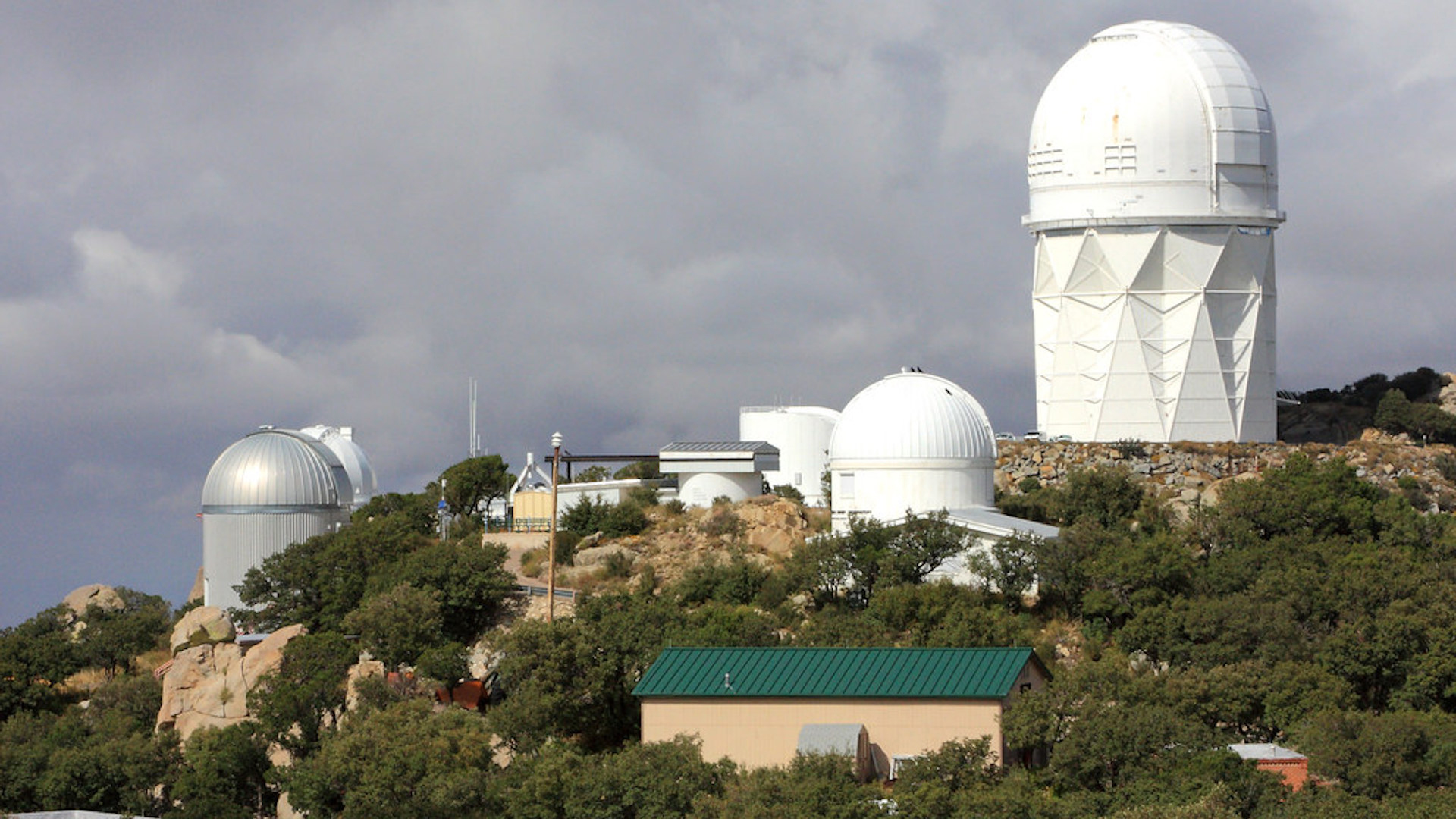 Telescopes atop Kitt Peak during the summer.