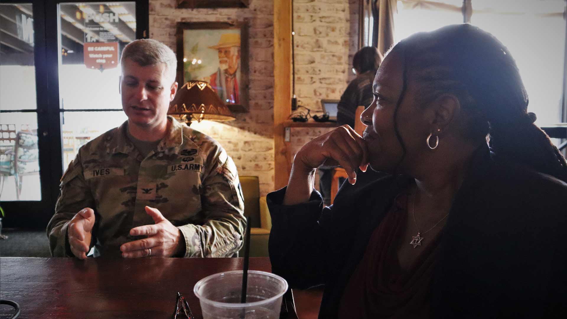 Fort Huachuca Garrison Commander Colonel John Ives (left) and Cochise County Superintendent of Schools Dr. Jacqui Clay (right) chat about their ideas about enhancing workforce and educational opportunities in Cochise County.  
