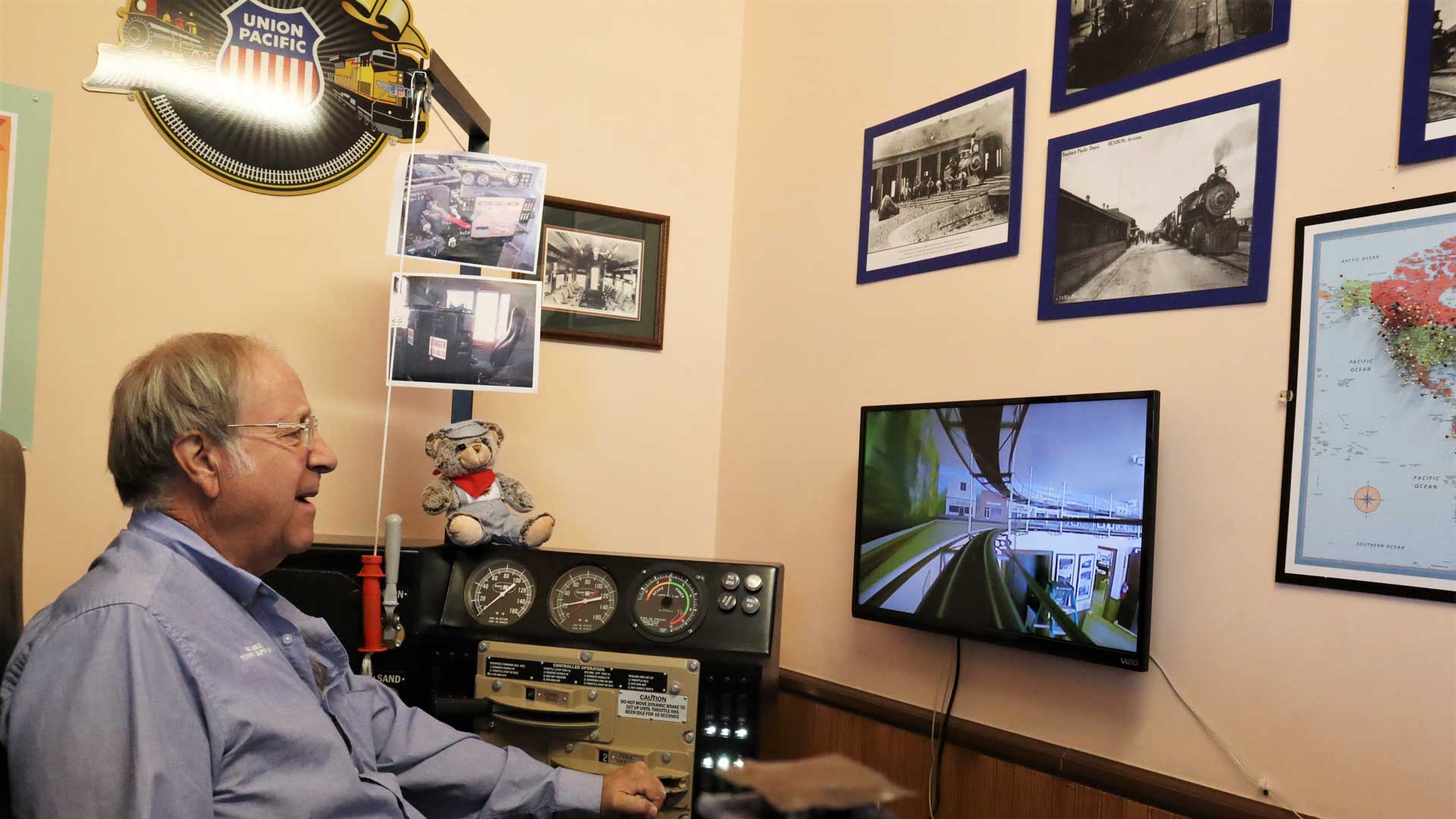 Bob Nilson, the Tourism Supervisor at the Benson Visitor’s Center, shows off the train simulator, which is a fan favorite at the visitor's center.