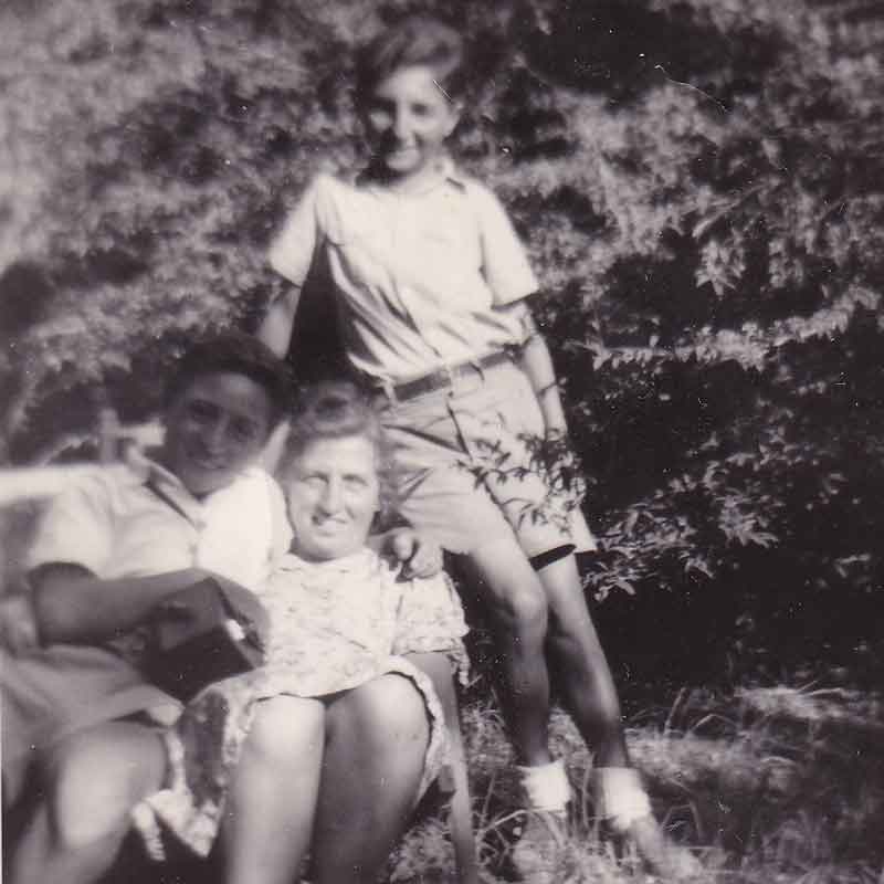 Wolfgang (seated), age 16, and his mother with Wolfgang’s friend Moshe—also a survivor. Taken in Palestine in 1947. 