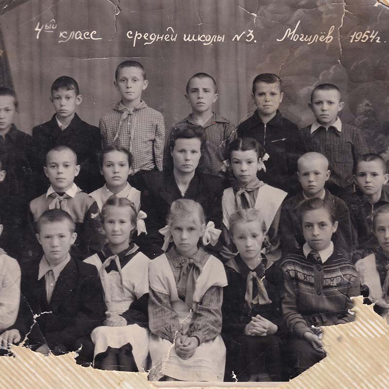 Ida (bottom row, second from right) in 1954 with her classmates. She is close to age 15 in this photo.
