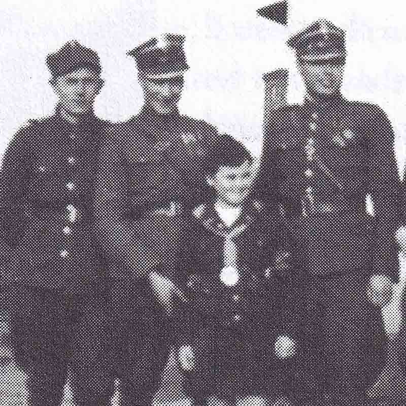 Wanda posed with Polish soldiers. She was able to survive by passing as a Polish Gentile.