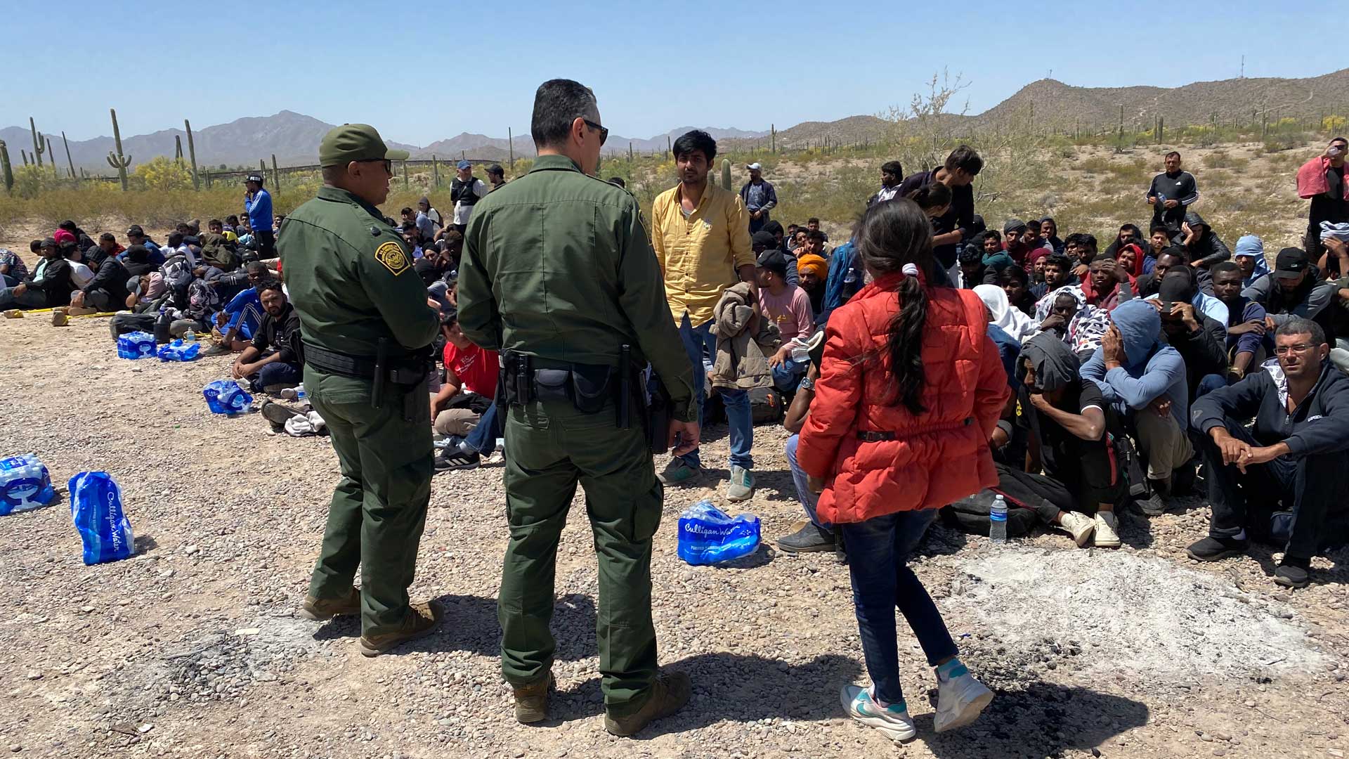 Border Patrol agents process a group of nearly 250 migrants in Ajo, Arizona, on Wednesday, May 10.