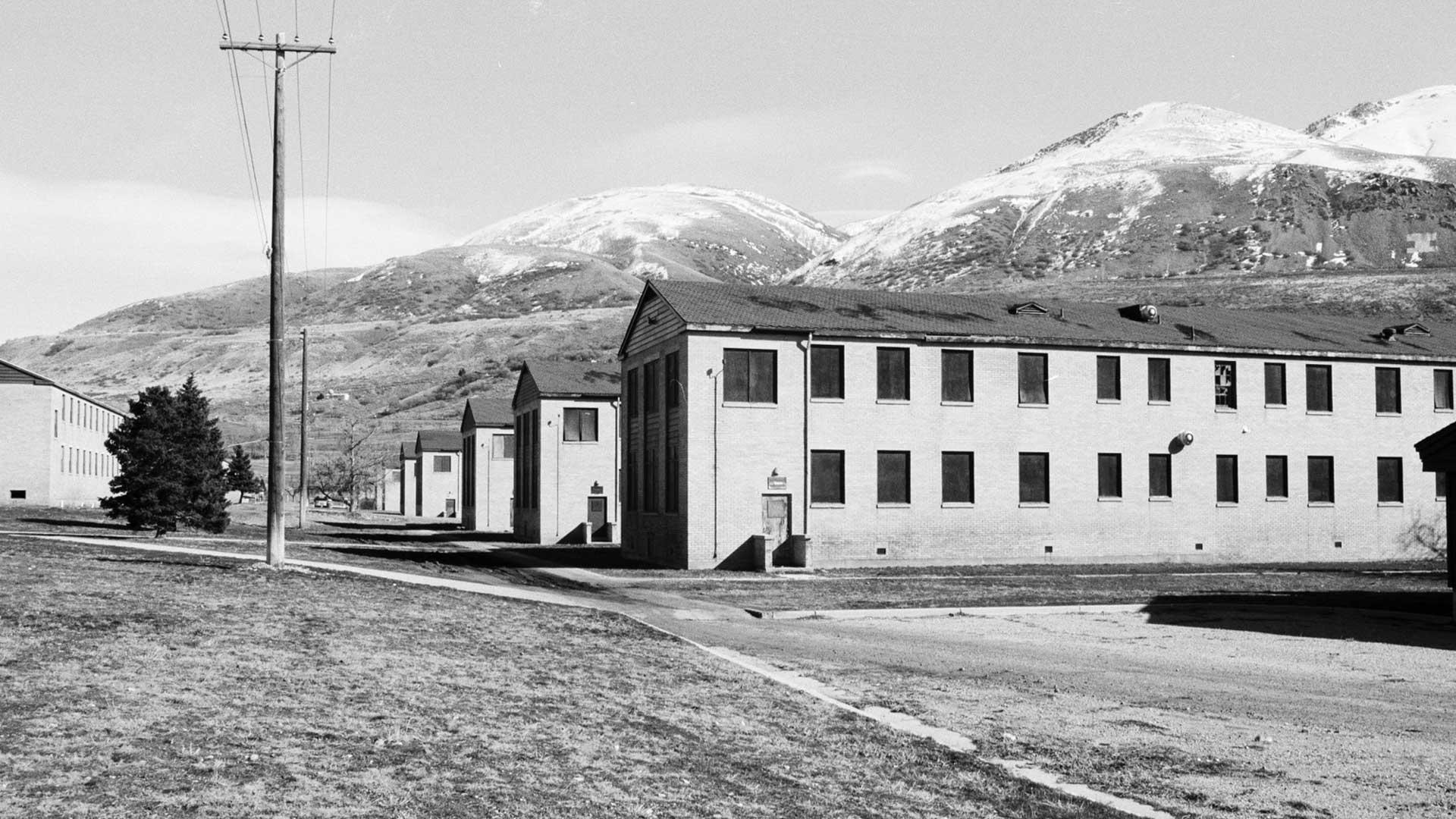 These buildings served as dormitories for Intermountain Indian School, the largest Indian boarding school in the U.S. The dorms were Bushnell General Military Hospital buildings that were then transformed into housing for Indigenous children.