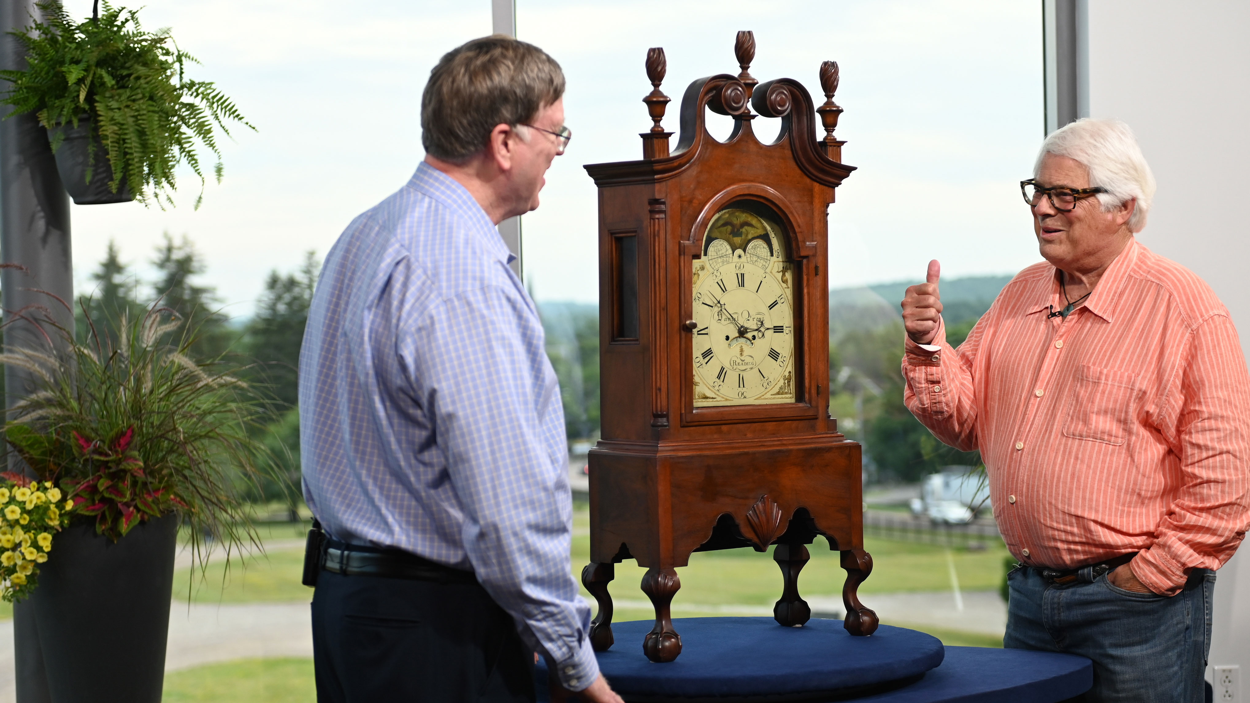 Gary Sullivan (left) appraises a Pennsylvania walnut shelf clock, ca. 1795, in Shelburne, VT. 