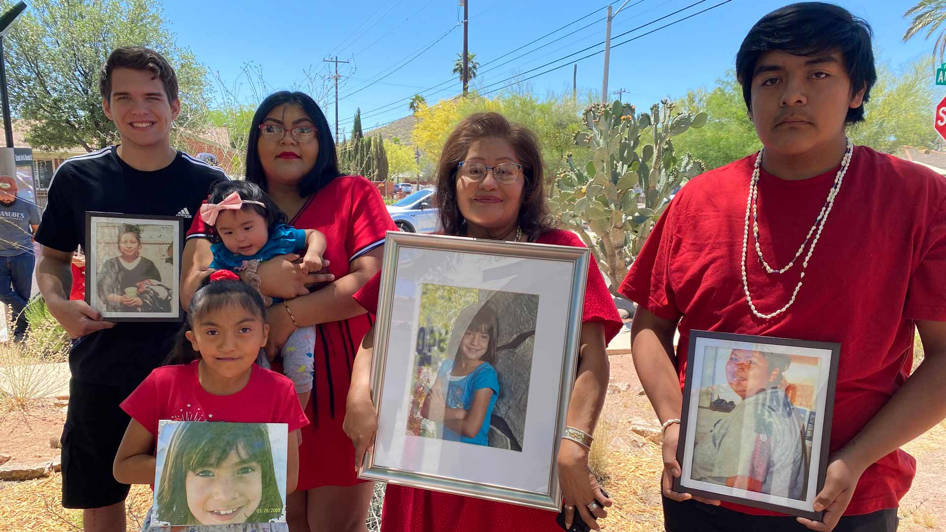 Olivia Rubio poses with her family during a press conference on missing and murdered Indigenous women at Tucson’s Ward 1 office, holding a photo of her granddaughter Rhia Almeida, who was killed in 2009. 