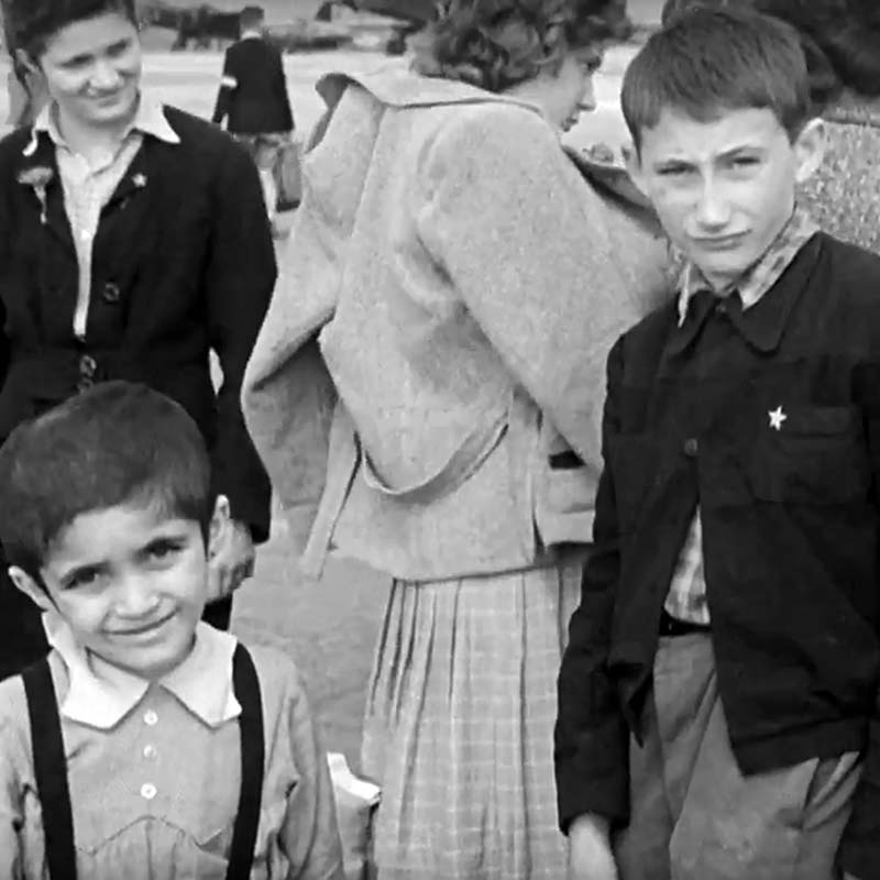 Sidney (right) after the war, waiting with other child survivors to be taken to England.