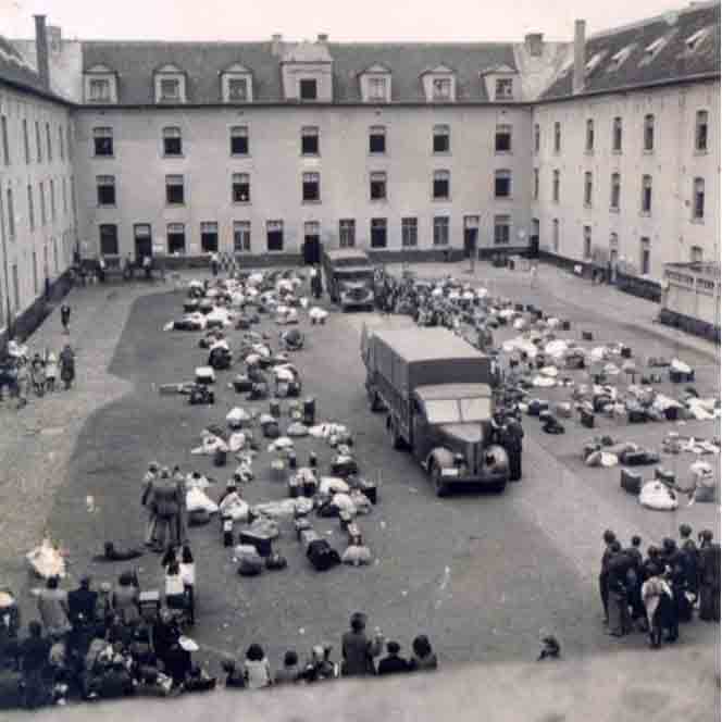 An archival photo showing the courtyard of the Nazi military headquarters where Belgian Jews were assembled before being deported. From here, they were taken by train to Antwerp and then put in cattle cars and taken to concentration camps. Willy assumes this is what happened to his parents. He has no information about how, where, or when they died.