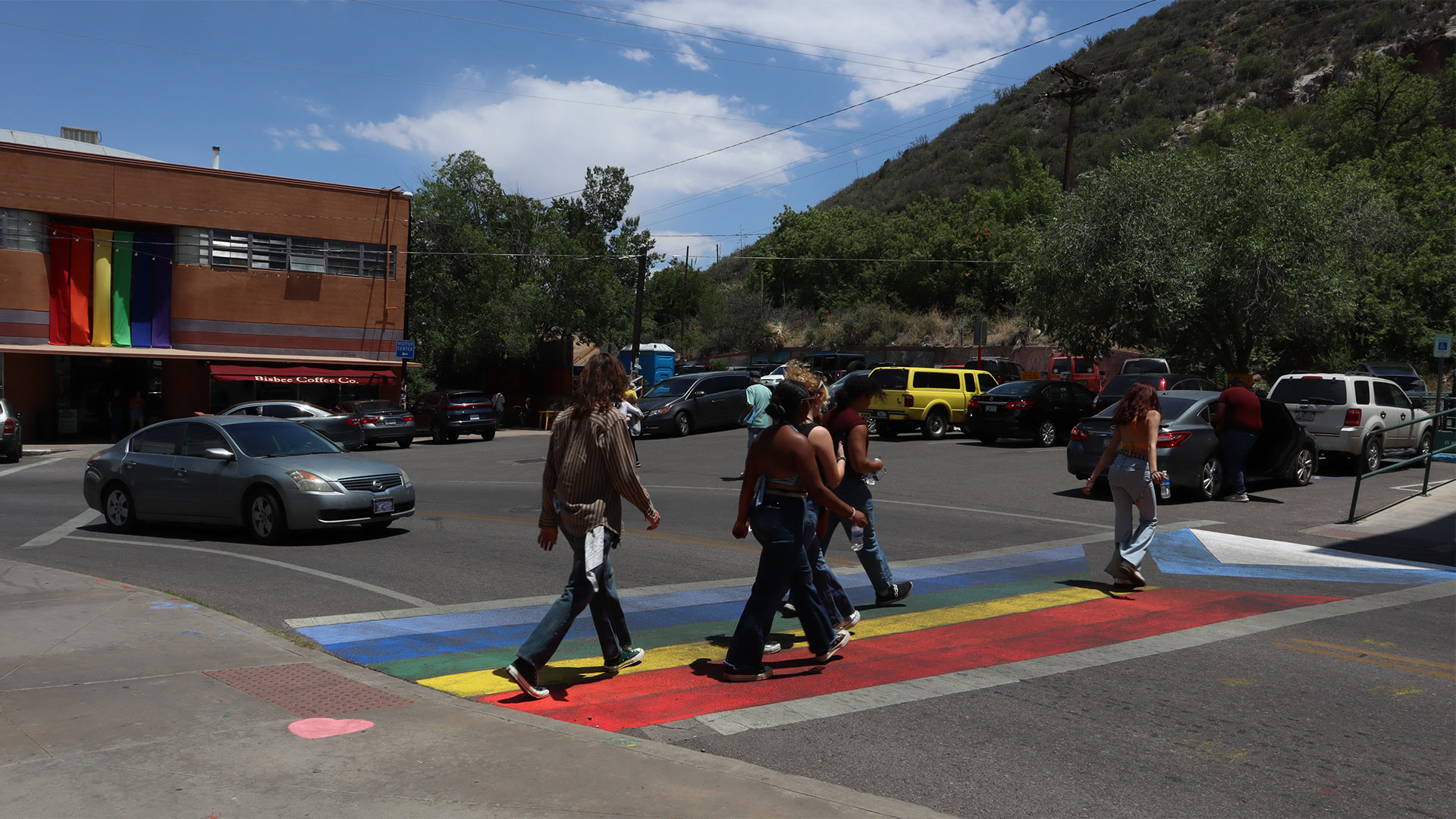 Attendees of Bisbee Pride cross the street along the rainbow-chalk crosswalk. June 16, 2023. 