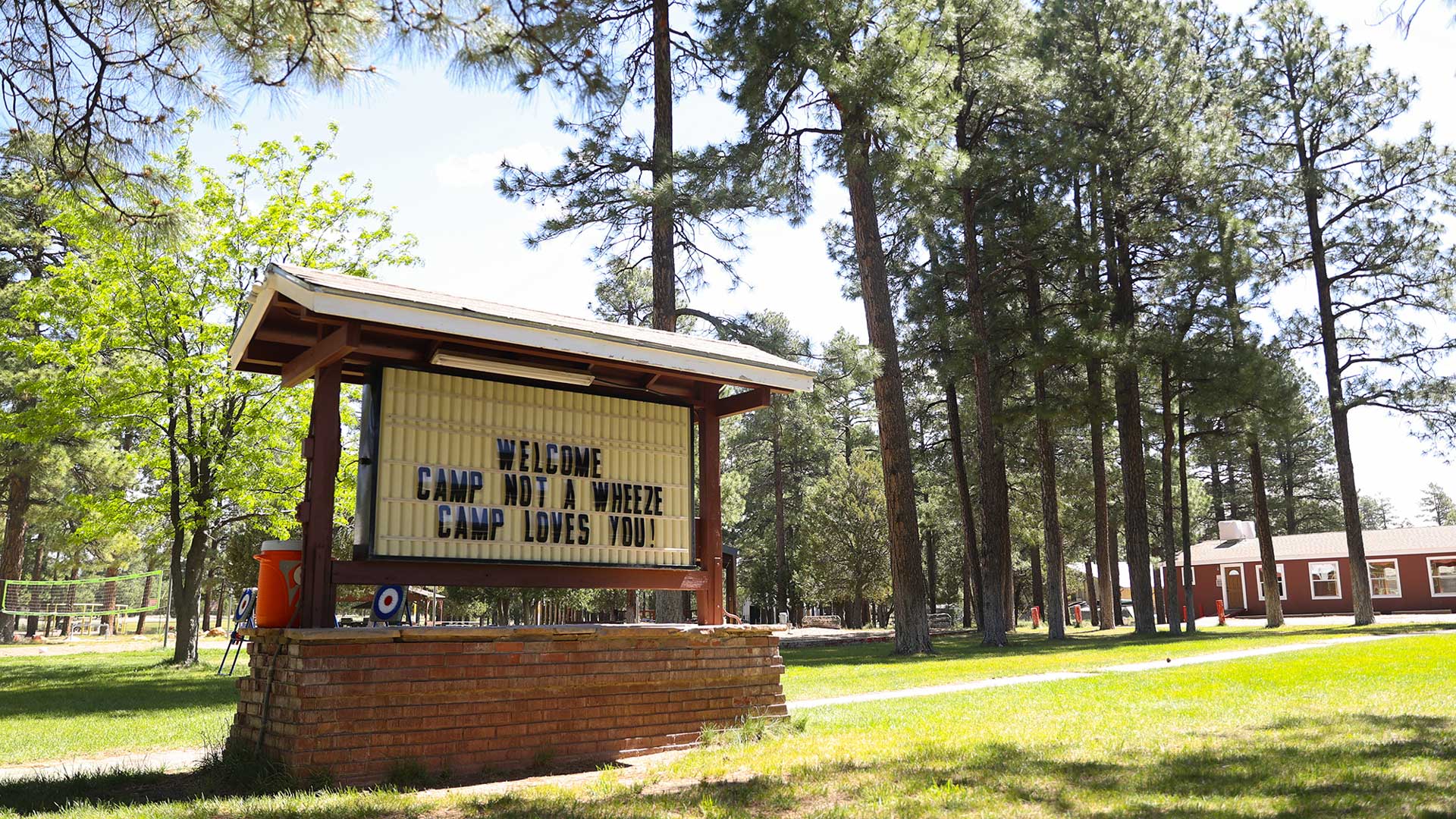 A sign welcomes campers to Camp Not-A-Wheeze in Heber, Arizona. The camp educates children ages 7 to 14 about asthma and how they can live normal lives despite their chronic lung disease.