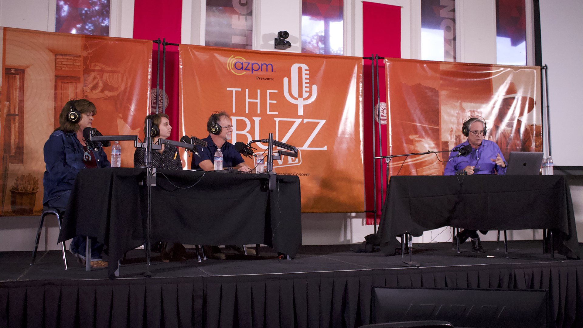 The first panel at The Buzz Live event on July 10, 2023 with guests (from left) Sonia Gasho, Ash Dahlke and Mark Apel and host Christopher Conover (right).