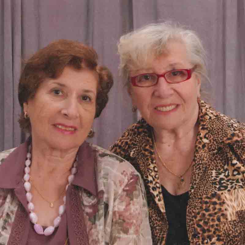 Yulia with her twin sister, Yevgenia, age 80.