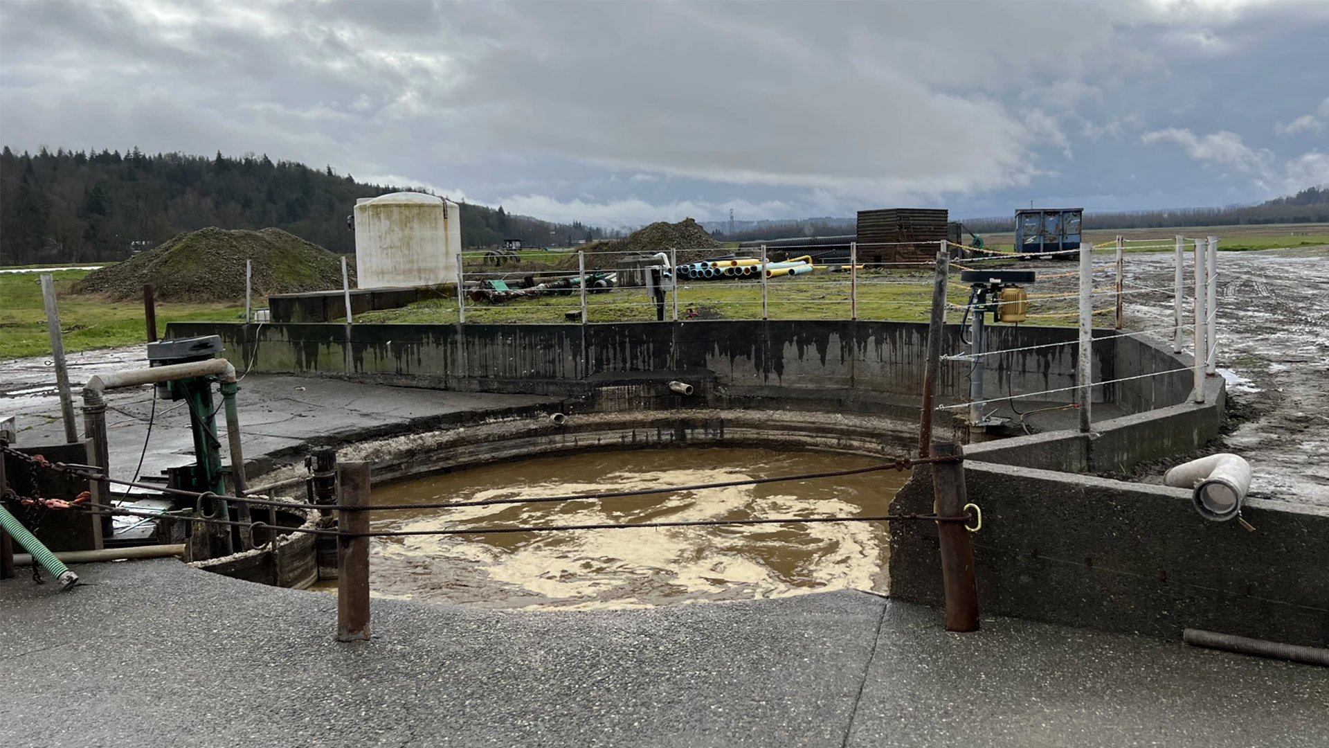 About 85,000 gallons a day of cow manure and food waste flow into the pit at Werkhoeven Dairy in Monroe, Washington. The digester captures methane that powers a generator, producing enough renewable energy for nearly 700 homes.