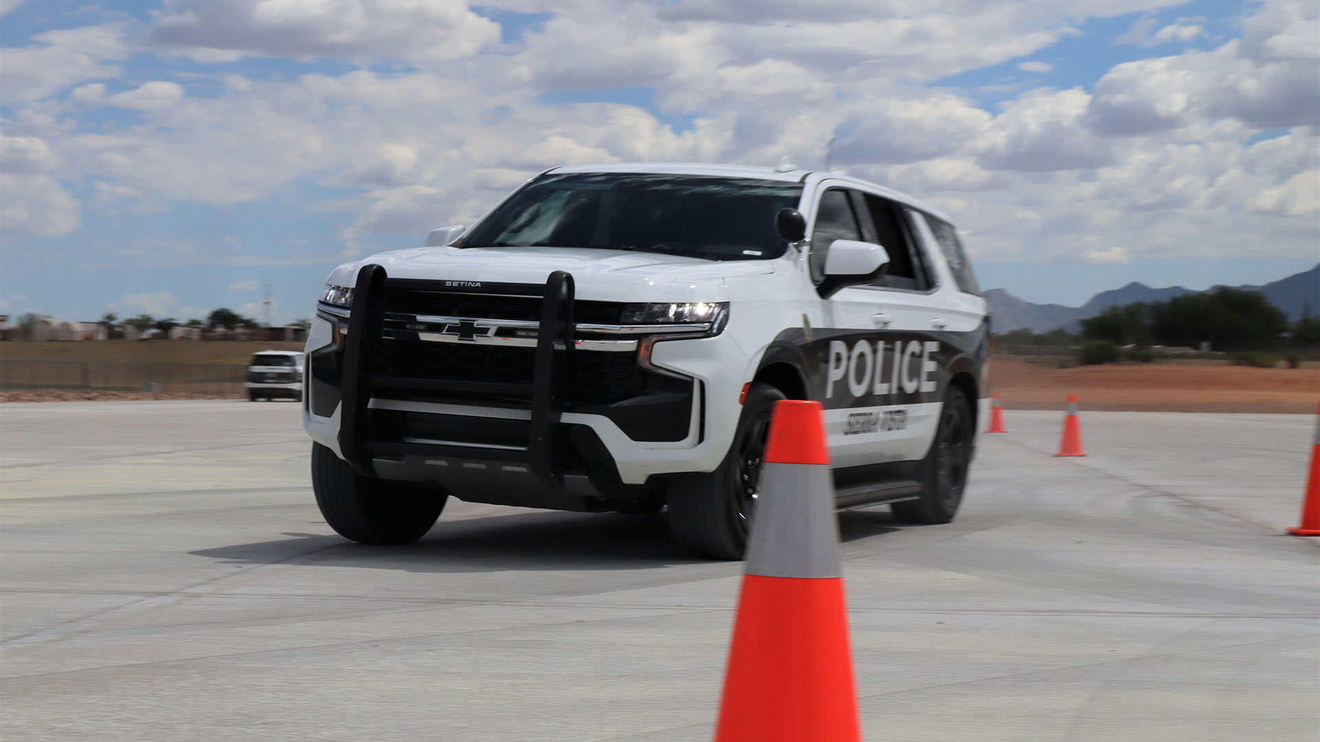 Sierra Vista Police Department officers test-run the new driving track for Cochise College's First Responders Academy Monday ahead of the ribbon-cutting ceremony. July 31, 2023. *Photo by Summer Hom, AZPM News.*