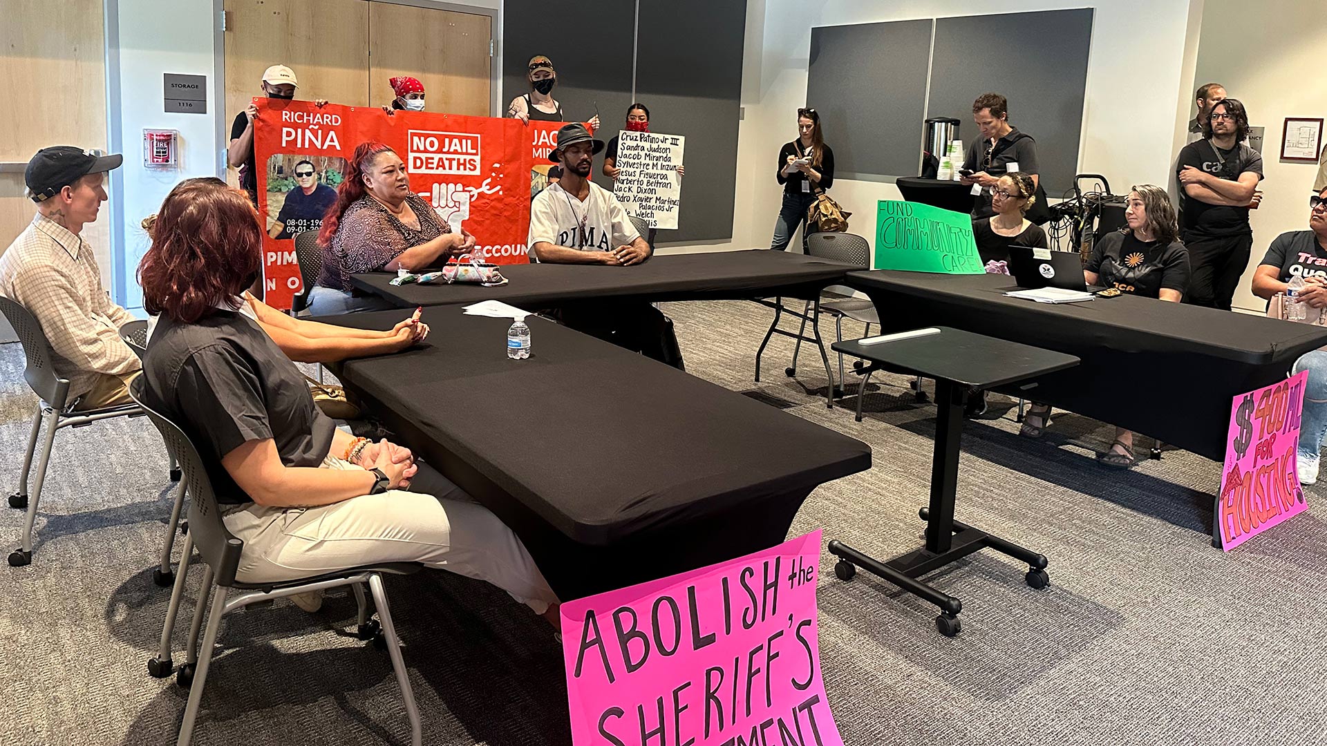 A local advocacy group, No Jail Deaths, continues a public meeting after the Pima County Adult Detention Center Blue Ribbon Commission decided to end the meeting due to disruption from the protestors on Thursday, Aug. 10, 2023 at the Pima County Historic Courthouse.