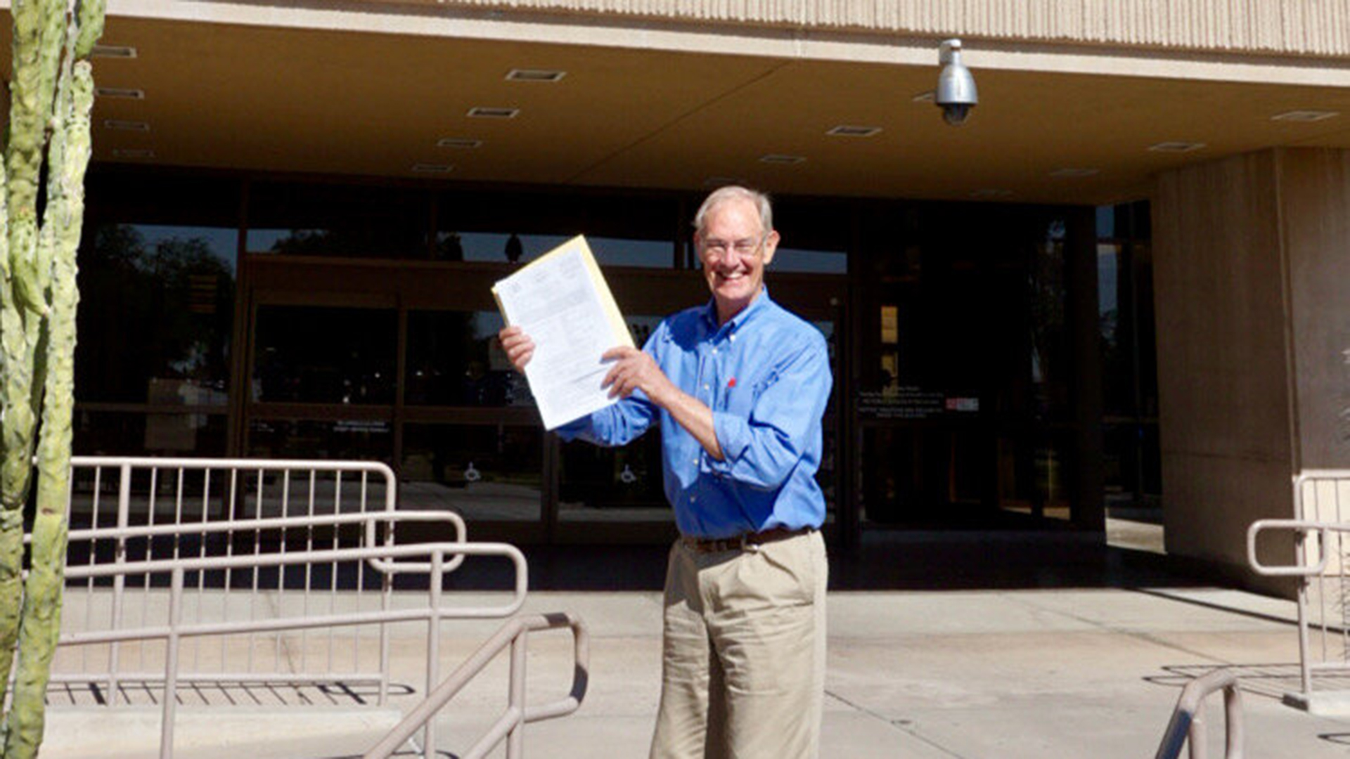 Goddard with paperwork