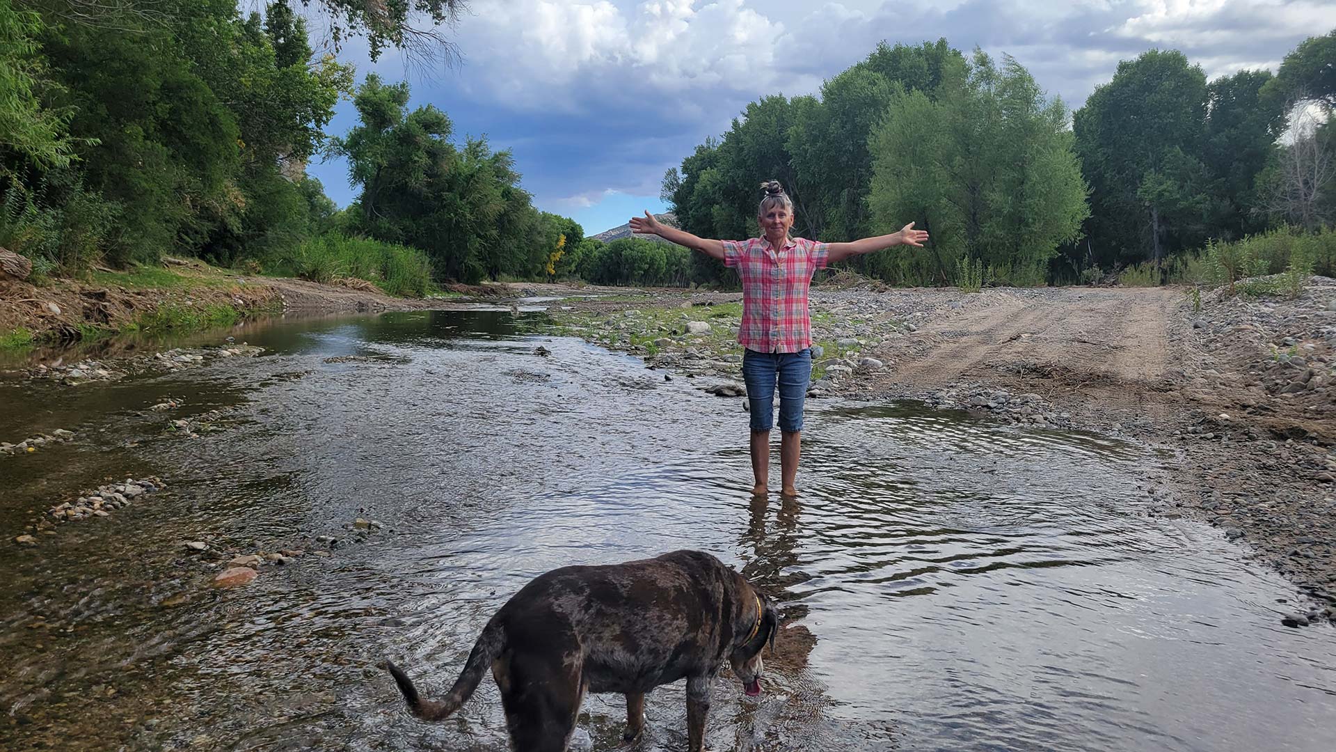 Mary Cooper and her dog, Havoc, enjoying the Hassayampa River.