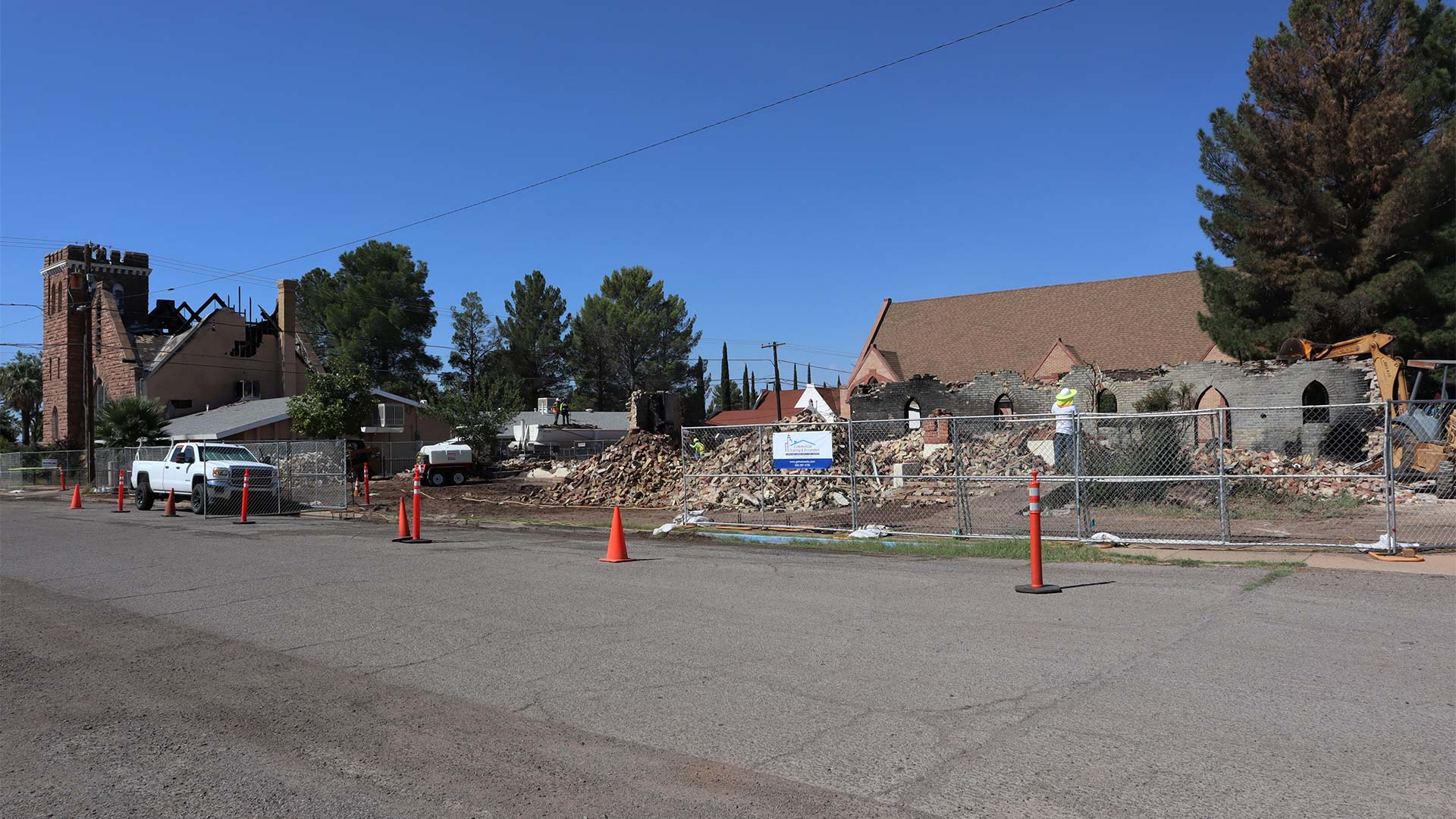 First Presbyterian Church (left) and what remains of Saint Stephen's Episcopal Church three months after a fire broke out at both churches. A suspect for arson awaits trial in federal court later this month. August 31, 2023.