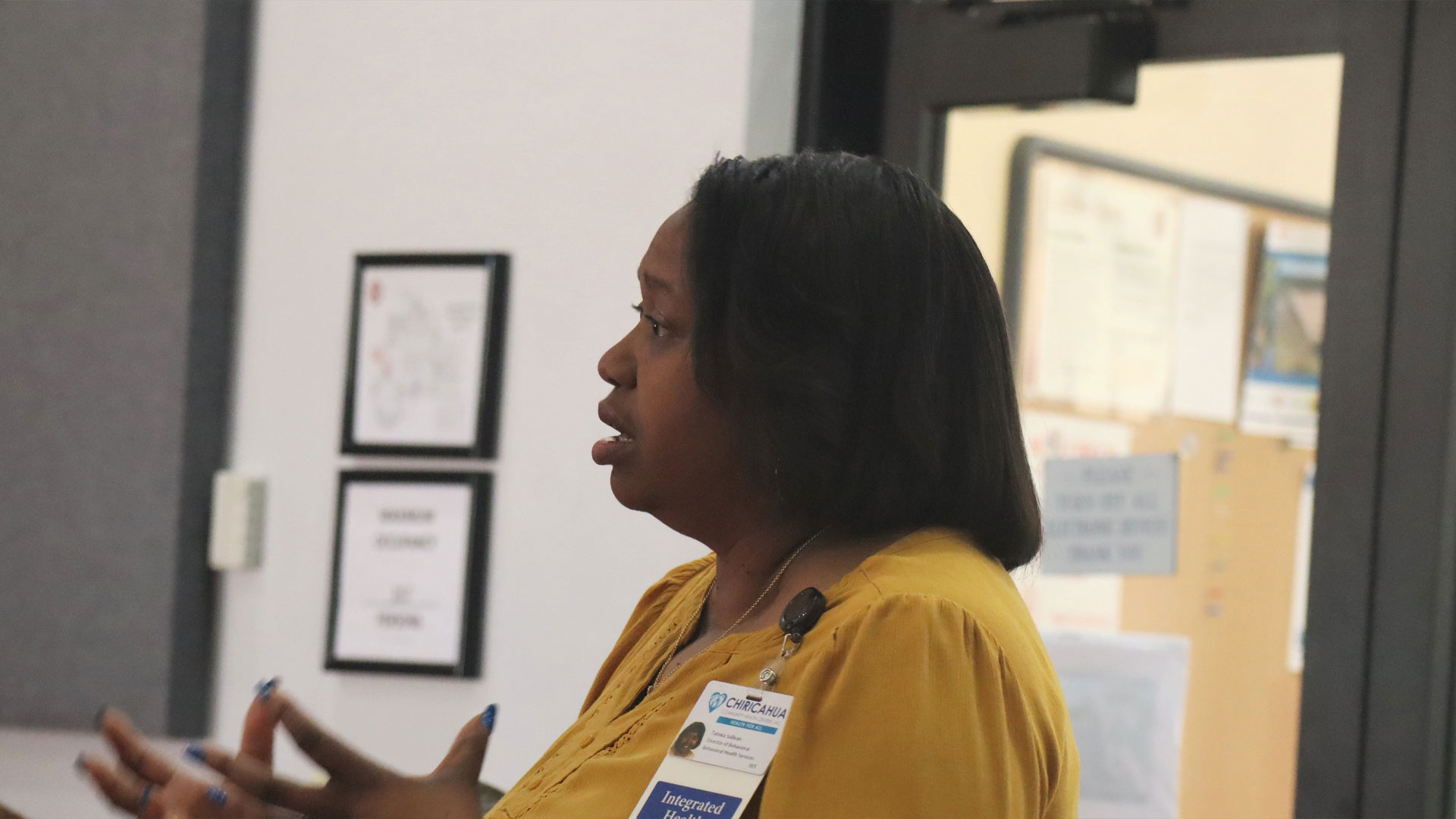 Tamika Sullivan, Director of Behavioral Health at Chiricahua Community Health Centers, Inc., speaks with Arizona Attorney General Kris Mayes during a round table discussion with local healthcare providers about how to use the county's share of the opioid settlement funds. July 26, 2023. *Photo by Summer Hom, AZPM News.*