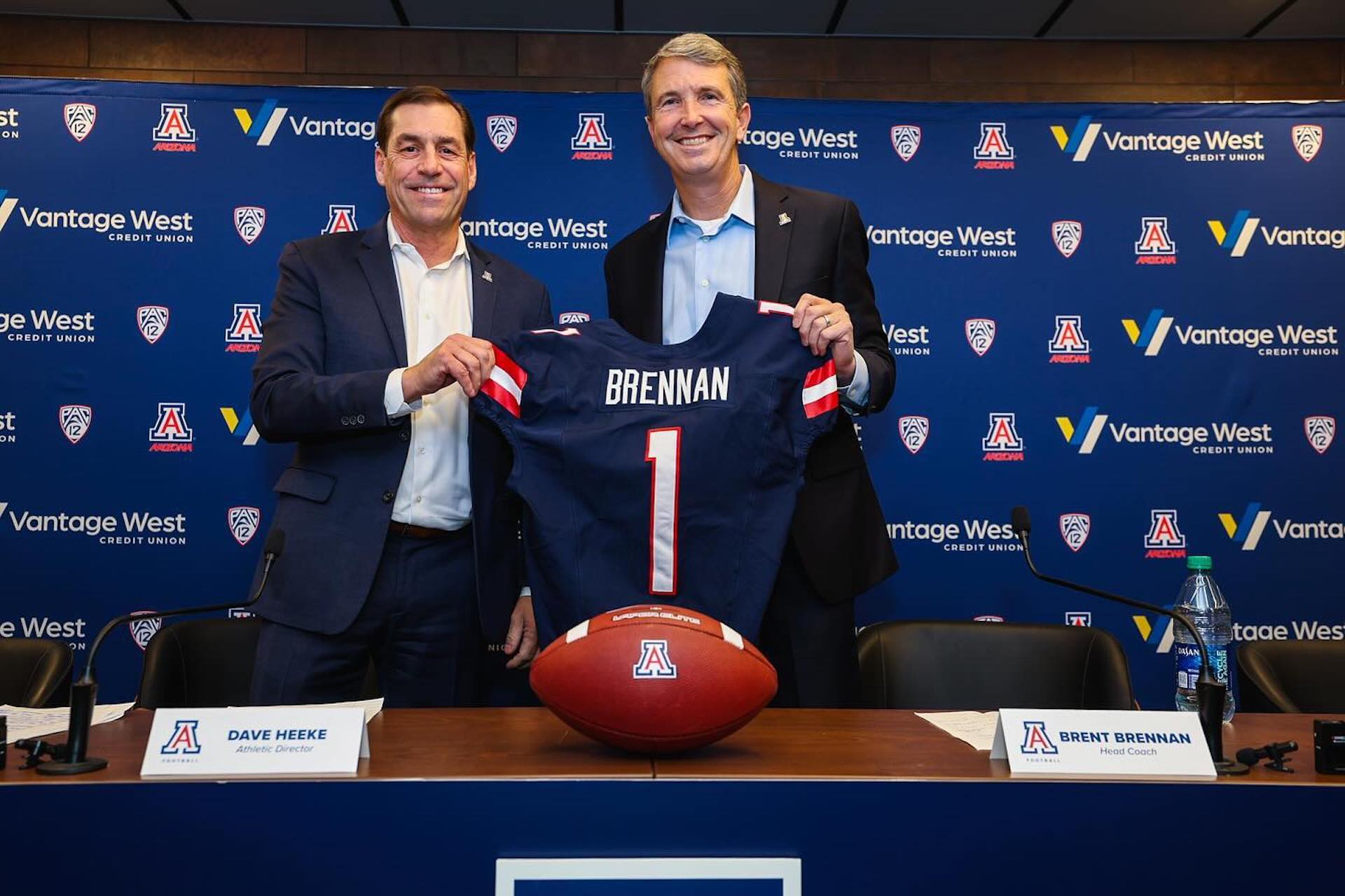 University of Arizona football coach Brent Brennan (r.) with UA athletic director Dave Heeke.