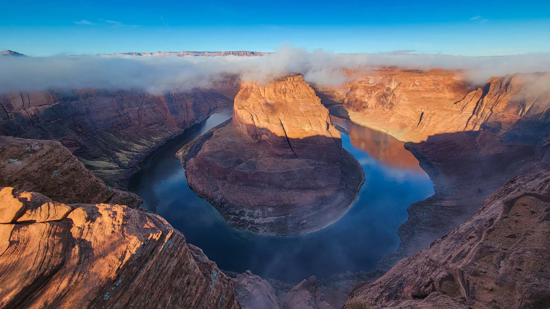 Horseshoe Bend, five miles downstream from the Glen Canyon Dam and Lake Powell, is a popular viewing spot for the Colorado River.