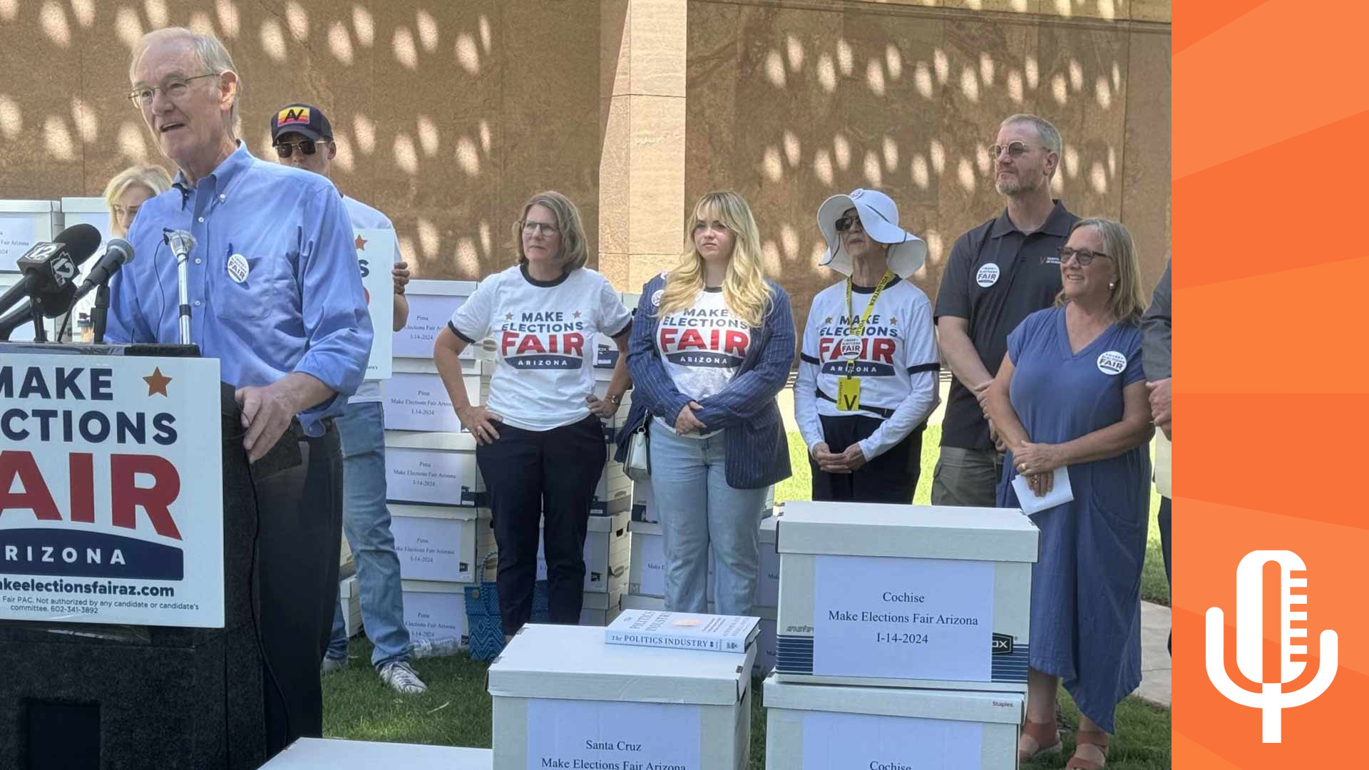 Former Arizona Attorney General and Phoenix Mayor Terry Goddard speaks surrounded by boxes of sheets with signatures that Make Elections Fair Arizona need to get their measure to qualify for the ballot at the state Capitol on Wednesday, July 3, 2024.