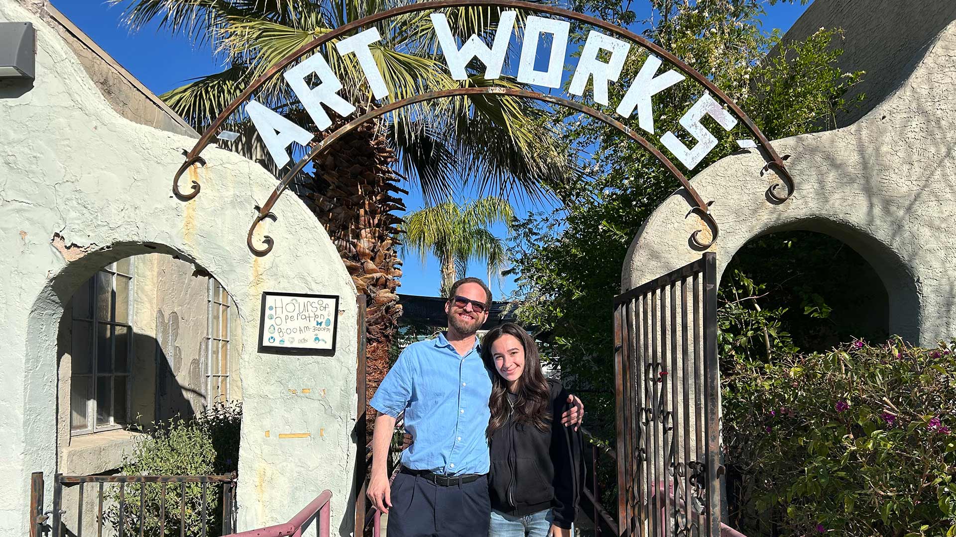 Brad Biddlecome (left) and Mari White (right) stand outside of ArtWorks. ArtWorks is a day program where adults with intellectual and developmental disabilities can practice and learn art. 