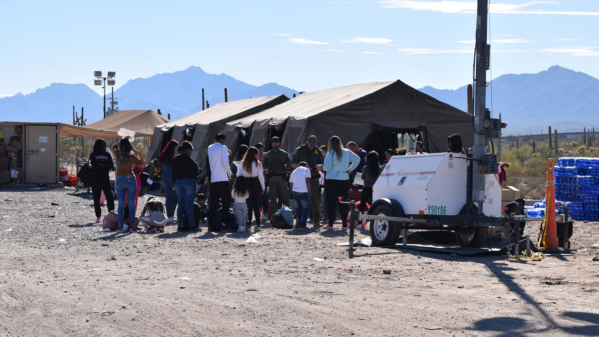 Border Patrol process families and children who crossed the border near Lukeville, Arizona, at a makeshift processing center, in December 2023.