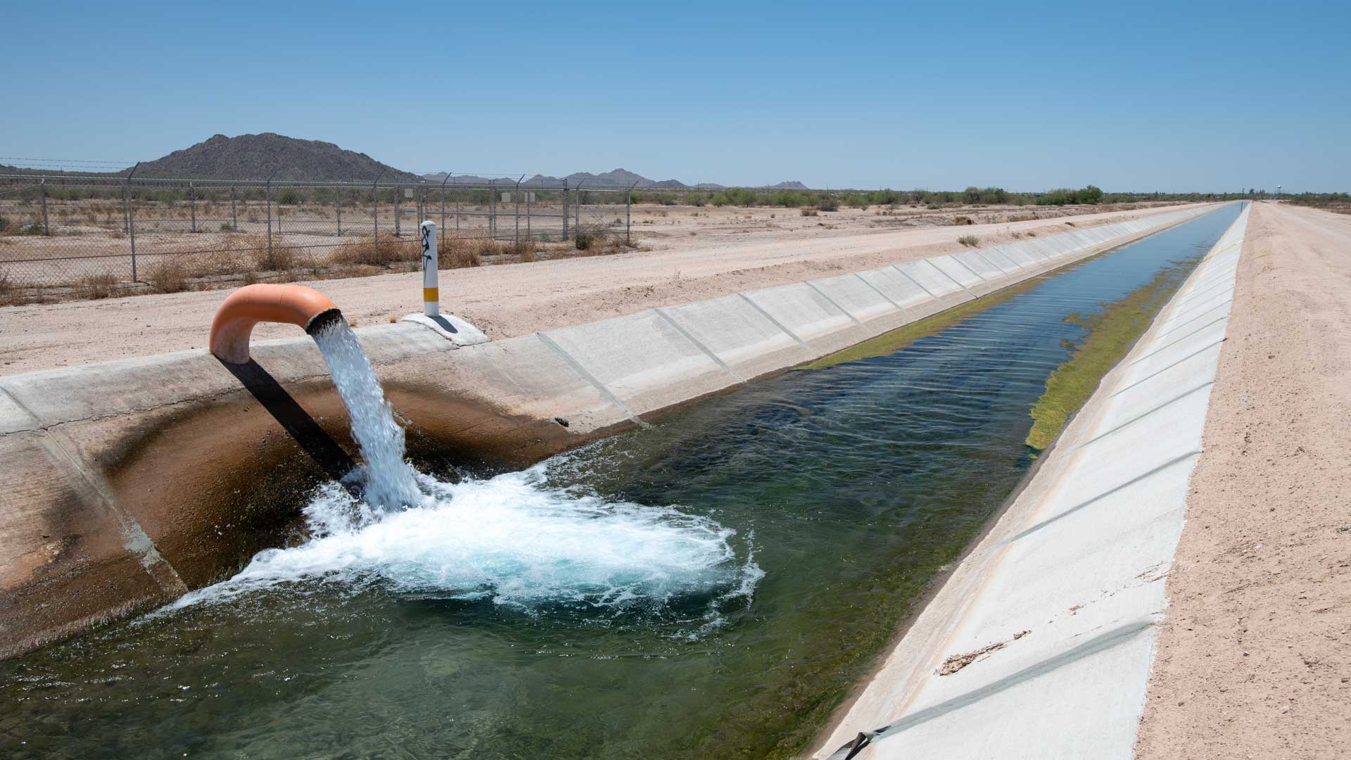 Water enters an irrigation canal on the Gila River Indian Reservation on May 7, 2021. The Gila River Indian Community is among the most important tribal players in ongoing negotiations about using water from the Colorado River.
