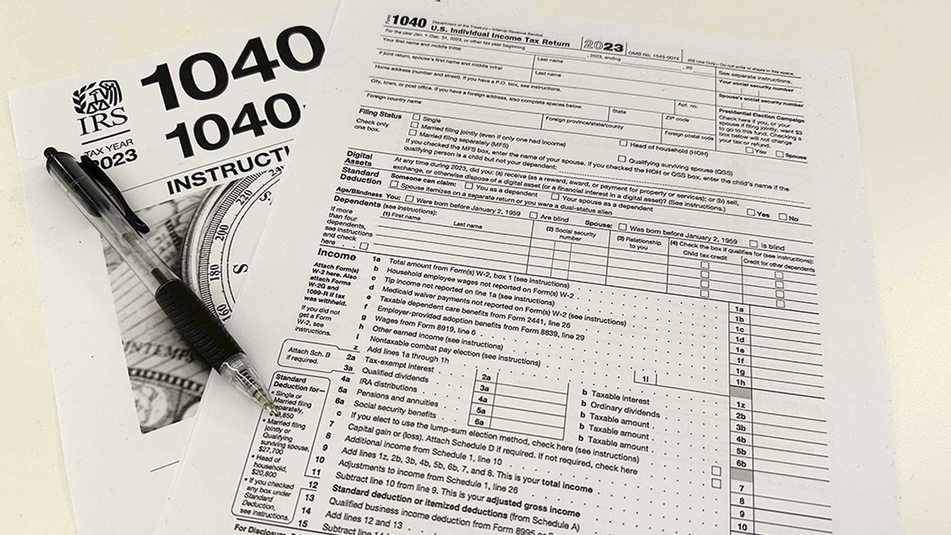 An Internal Revenue Service 2023 1040 tax form and instructions are shown on Jan. 26, 2024 in New York. It's tax season in the U.S., and for many people, filing tax returns can be a daunting task that's often left until the last minute.