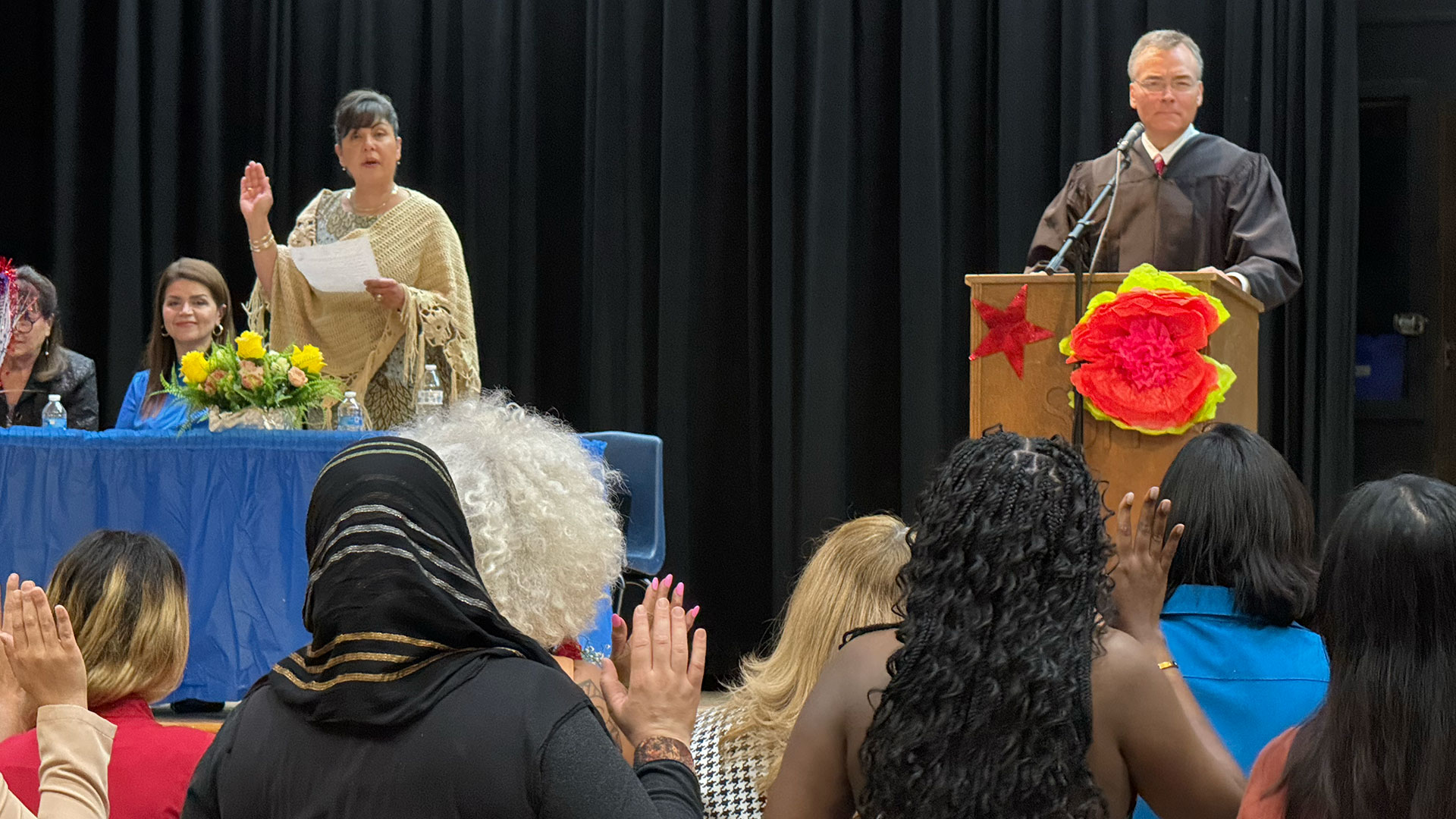 Tucson officially honors 23 new citizens at a TUSD middle school
