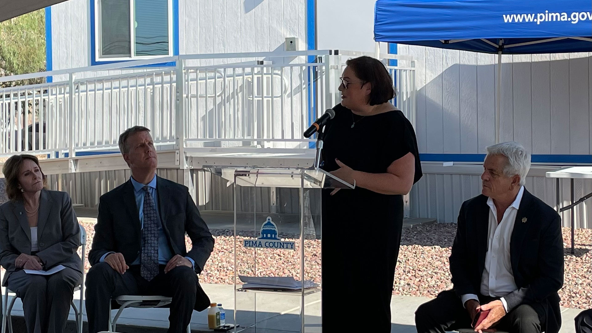 Justice Services Director Kate Vesely speaks at the official opening of the Pima County Transitions Center on Thursday, Sept. 7, 2023. From left to right: County Administrator Jan Lesher, Supervisor Rex Scott, Vesely, and Pima County Sheriff Chris Nanos. 