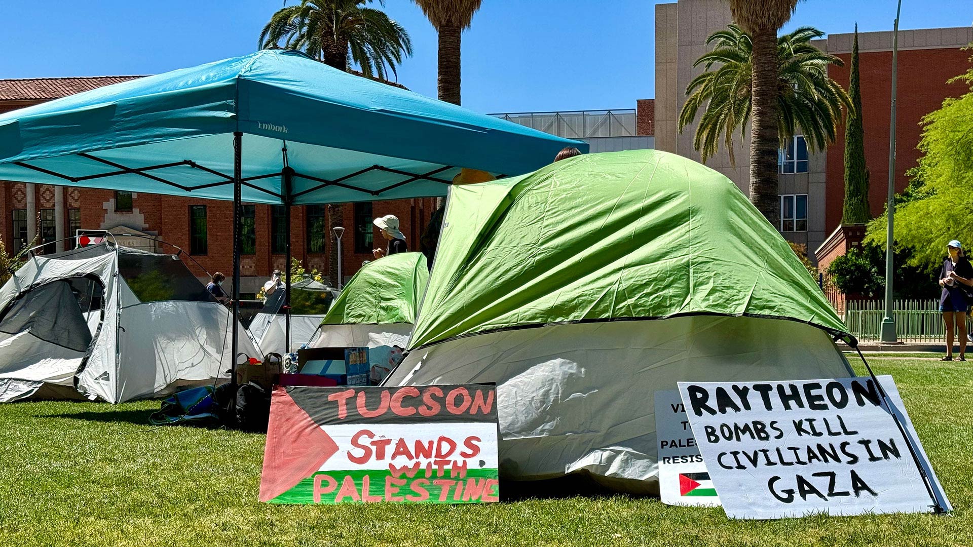 Pro-Palestinian signs at the Gaza solidarity encampment at the University of Arizona mall on Monday, April 29, 2024.  