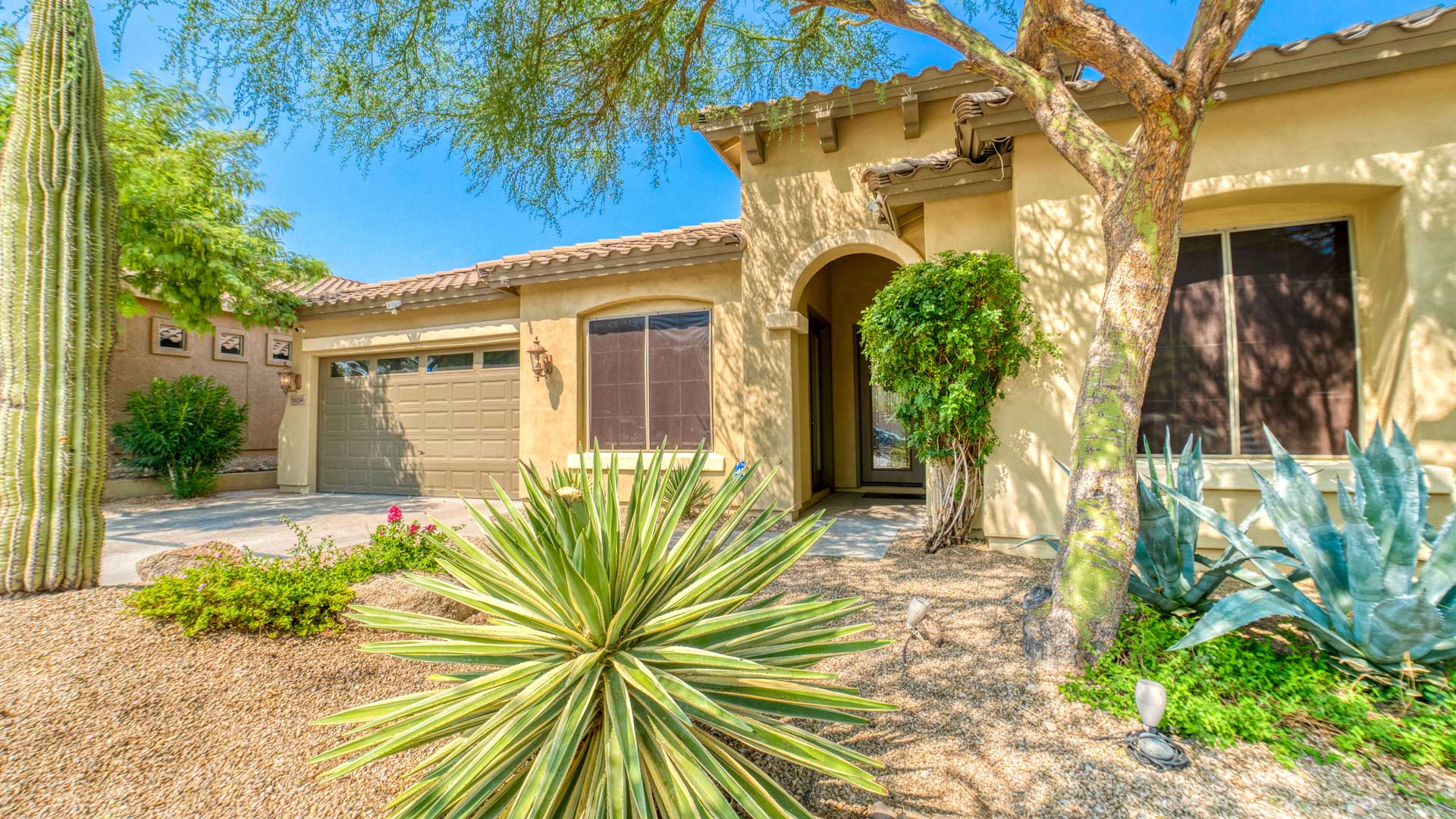 A house with desert landscape.