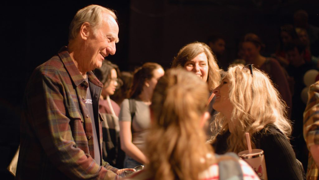 Craig T. Nelson with students