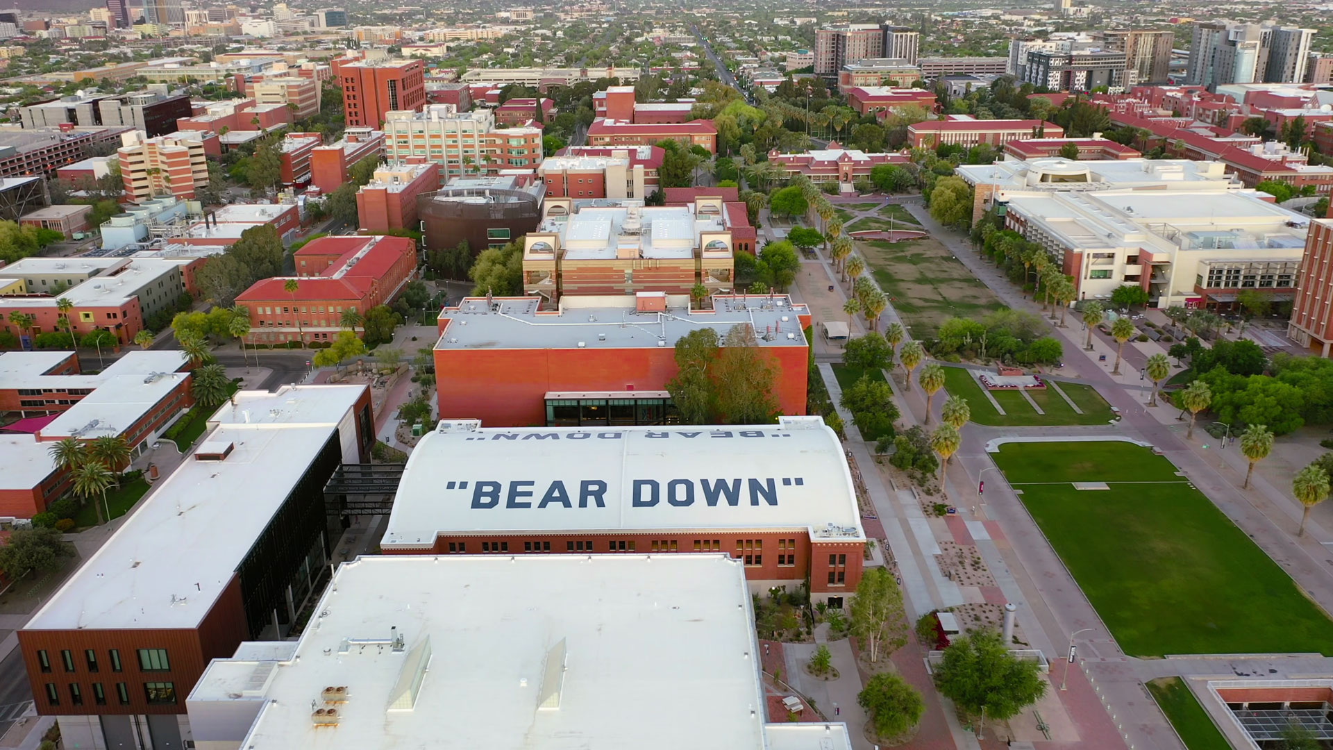 A drone shoot showing the words 'Bear Down' painted across the top of the Bear Down Gym on the campus of the University of Arizona.