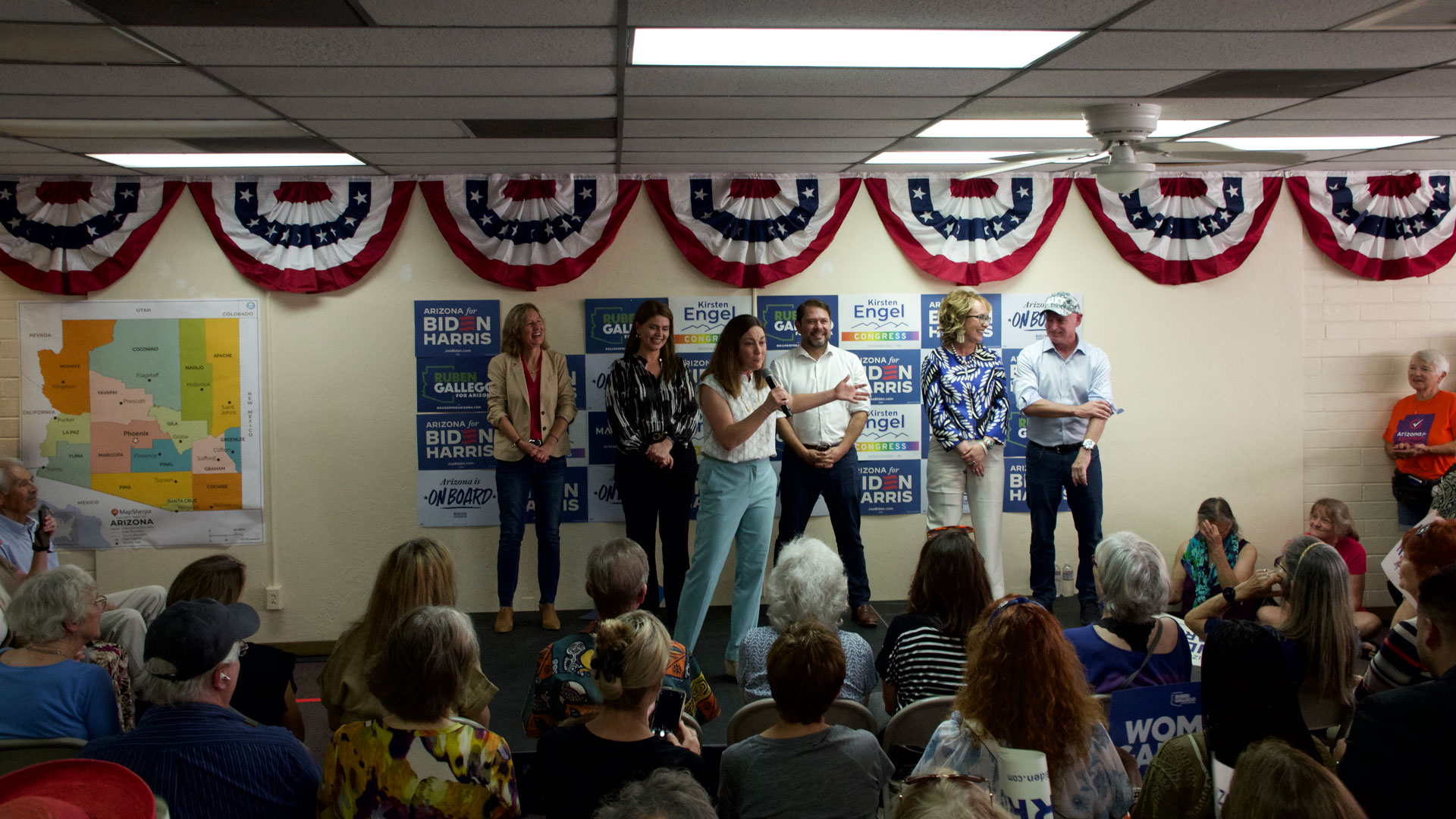 The Democratic Party opened its new headquarters in Tucson, Arizona, featuring noteworthy guest speakers. From left to right, congressional candidate Kirsten Engel, Tucson Mayor Regina Romero, President of End Citizens United Tiffany Muller, U-S Senate candidate Ruben Gallego, former Congresswoman Gabrielle Giffords, and Senator Mark Kelly.
