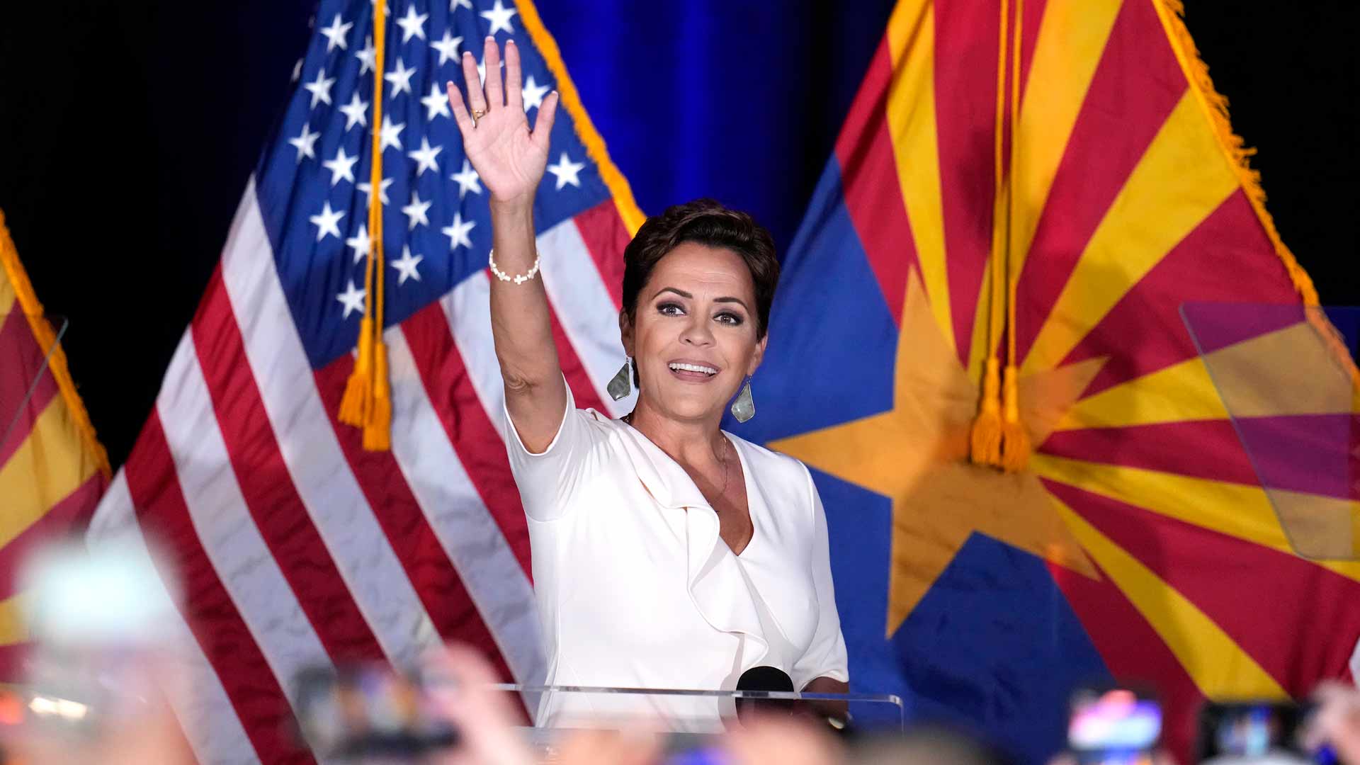 Republican Arizona Senate candidate Kari Lake waves to supporters as she arrives on stage after being declared the primary winner Tuesday, July 30, 2024, in Phoenix. 