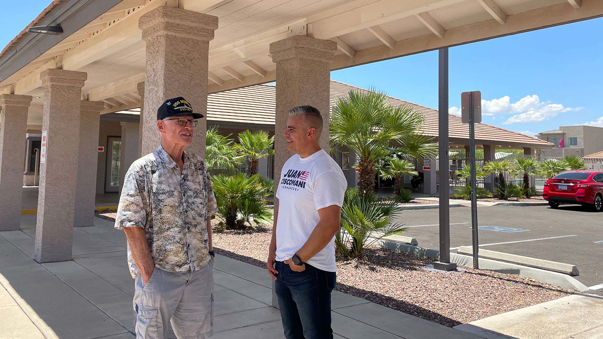 Congressman Juan Ciscomani talks to a constituent casting a primary vote outside a polling center in Tucson, Ariz., on Tuesday, July 30, 2024. 